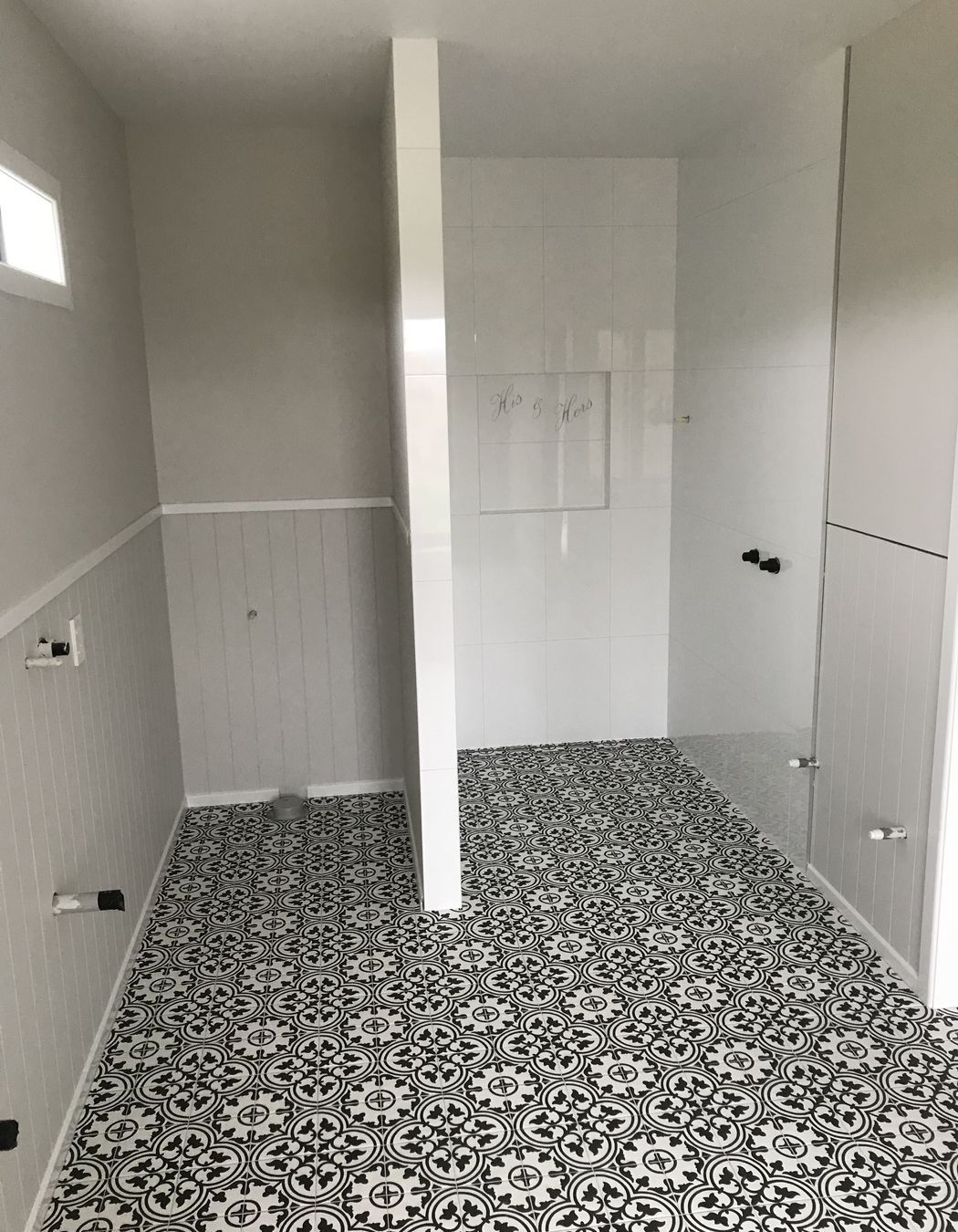 Tiled bathroom floor and shower walls