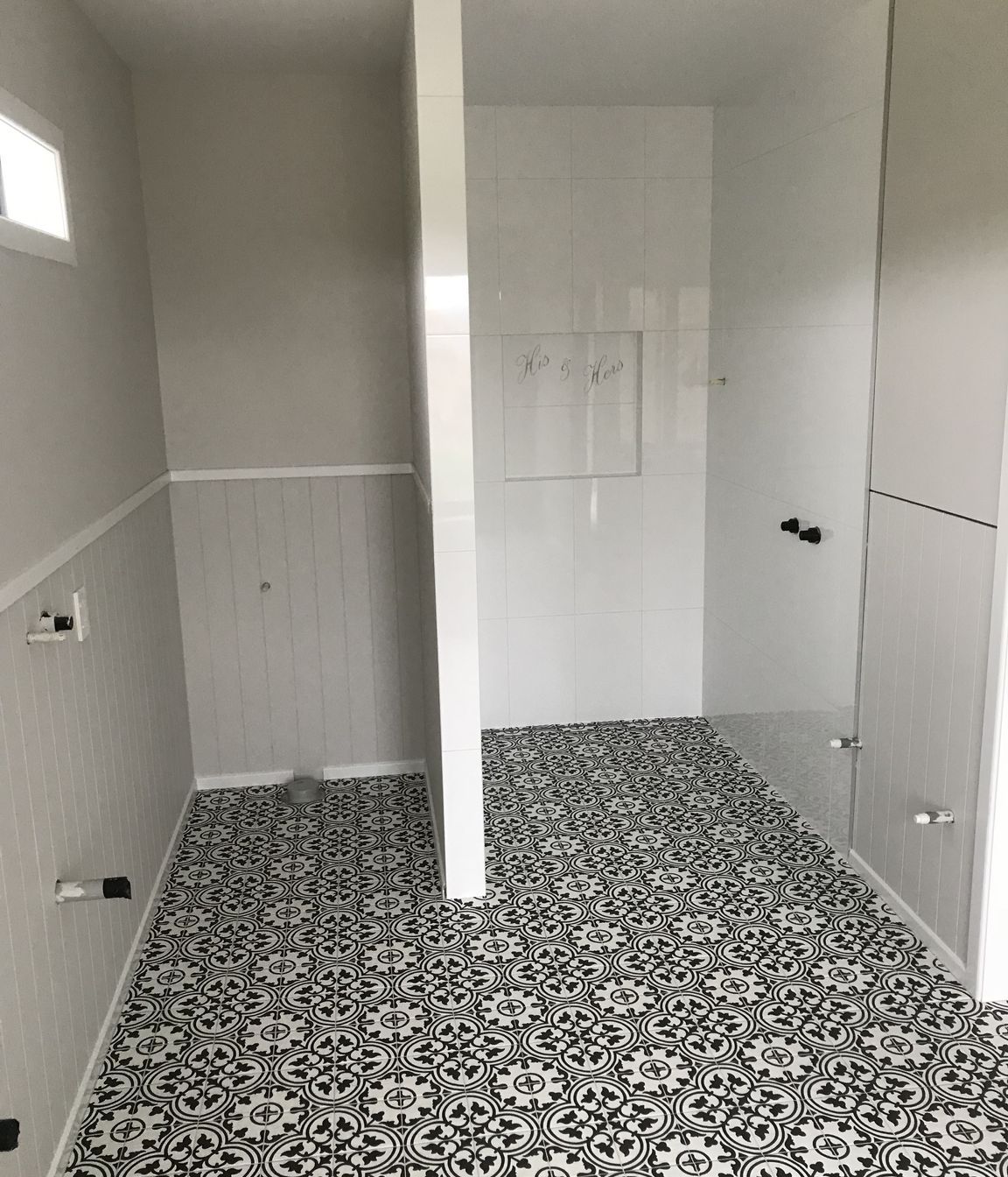 Tiled bathroom floor and shower walls
