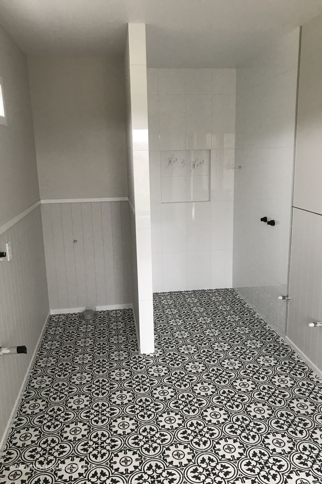 Tiled bathroom floor and shower walls