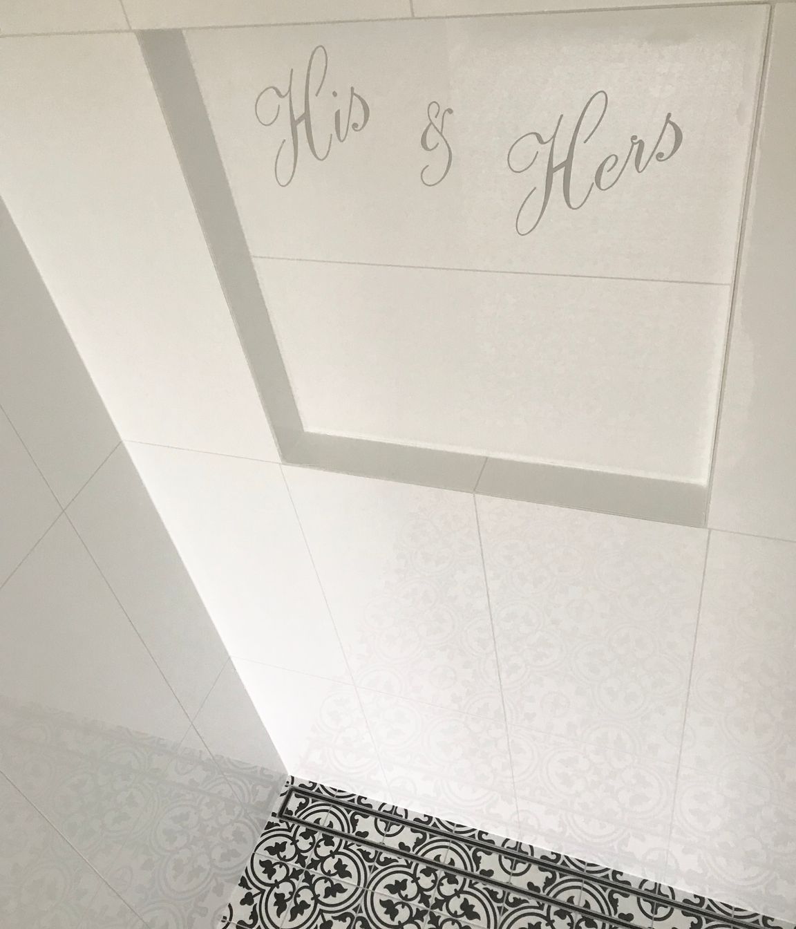 Shower niche with personalised design cut into tile &amp; floor channel drain