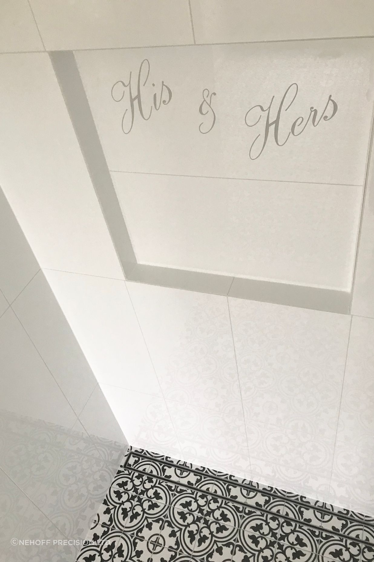 Shower niche with personalised design cut into tile &amp; floor channel drain