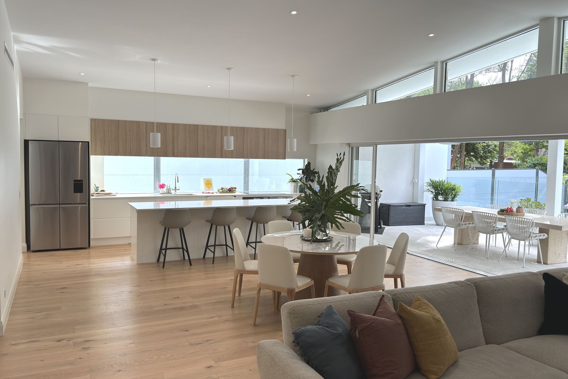 The sliding doors disappear into the wall to connect indoors with outdoors.