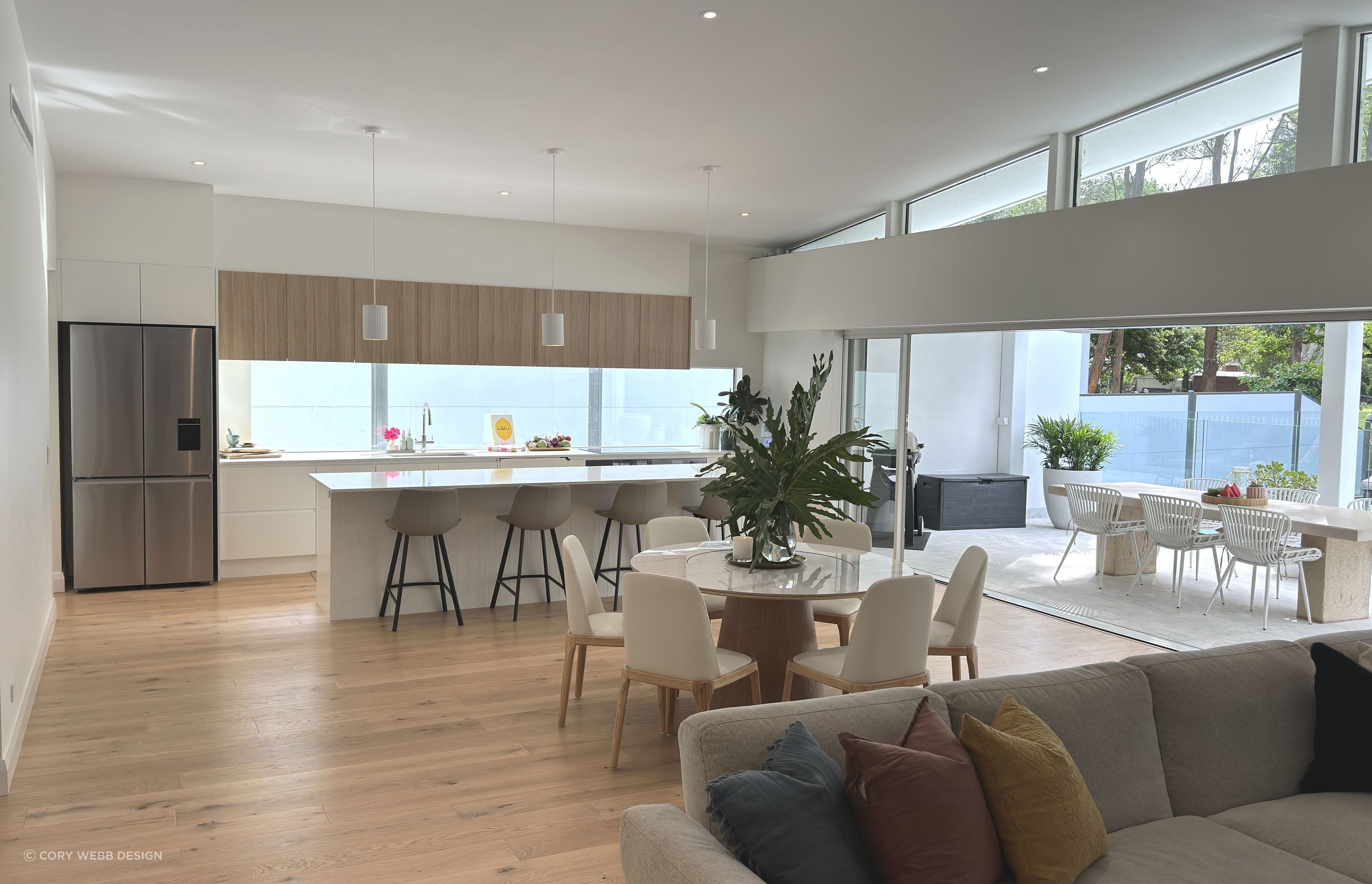 The sliding doors disappear into the wall to connect indoors with outdoors.