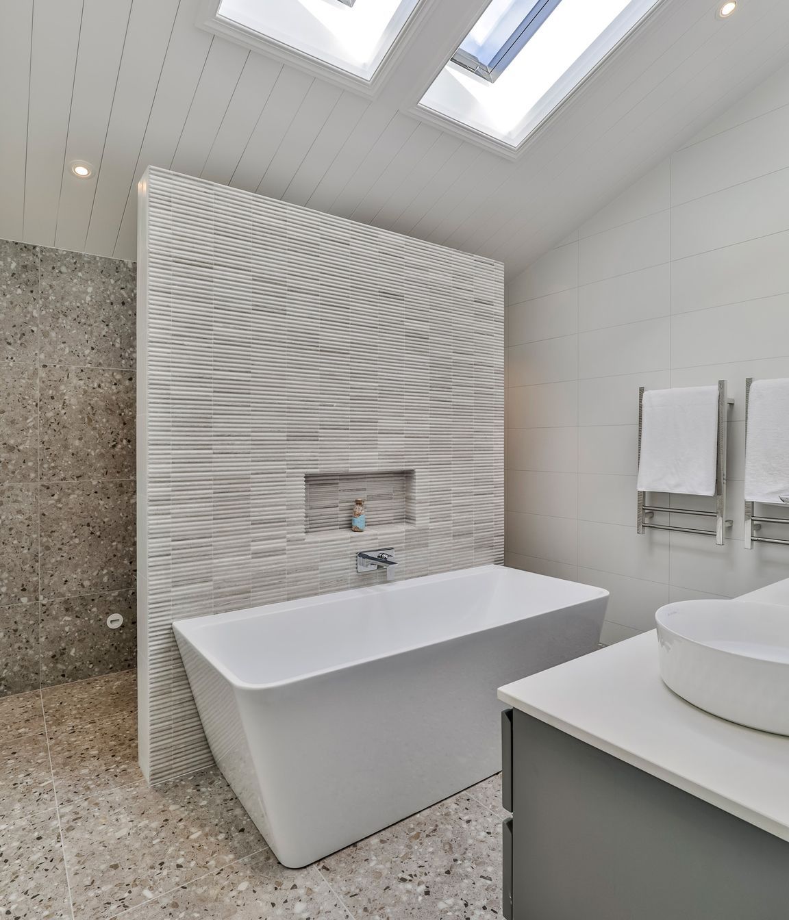 TILE DEPOT / Tiles: Colosseum Travertine 305x305mm, Blanco Brillo Matt 300x600mm, Frammenta Taupe 597x597mm / Heated Towel Rails: Heirloom Forme