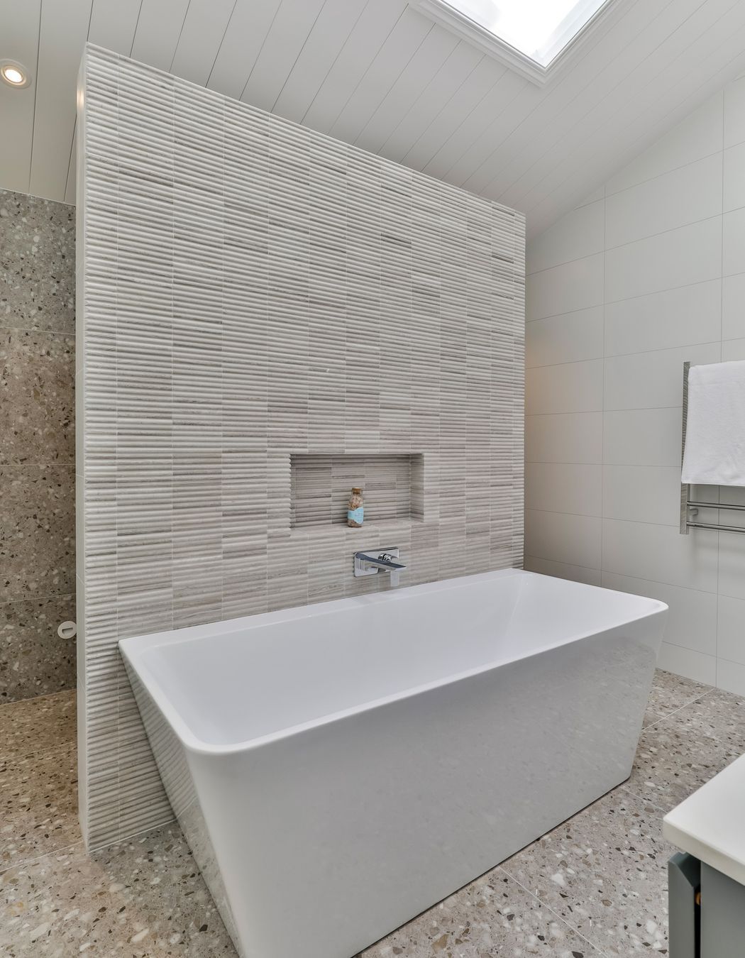 TILE DEPOT / Tiles: Colosseum Travertine 305x305mm, Blanco Brillo Matt 300x600mm, Frammenta Taupe 597x597mm / Tap: Olympia Wall Mounted basin Mixer Chrome