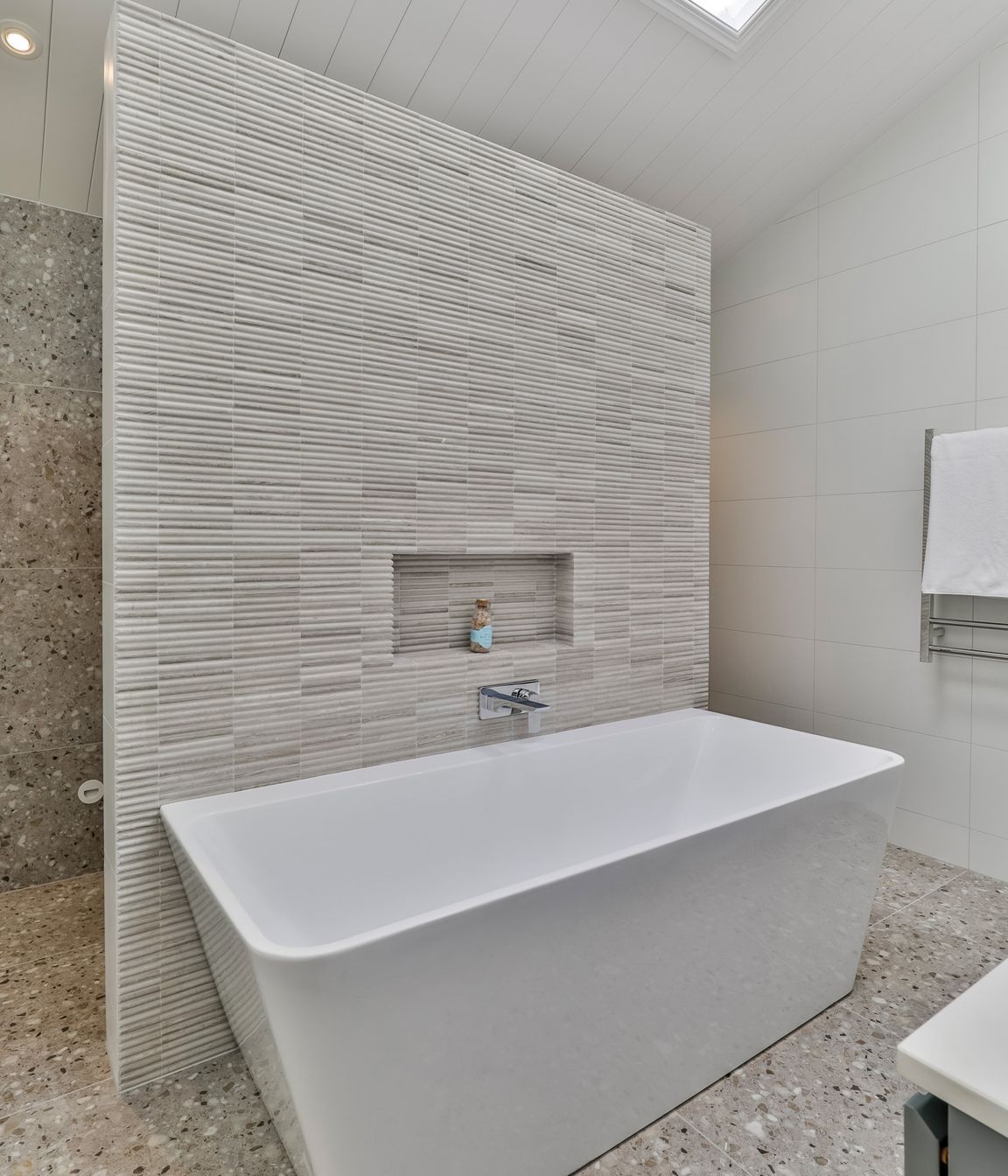 TILE DEPOT / Tiles: Colosseum Travertine 305x305mm, Blanco Brillo Matt 300x600mm, Frammenta Taupe 597x597mm / Tap: Olympia Wall Mounted basin Mixer Chrome