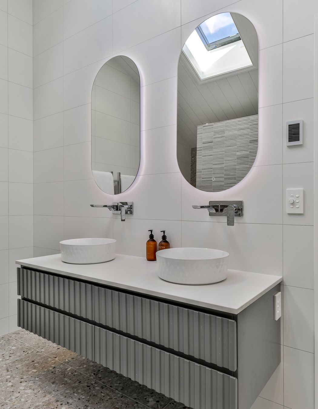 TILES & BATHWARE SUPPLIED BY TILE DEPOT .  Vanity: Customised AIntree Wall Hung 1500mm / Basins: Radial 355 textured white / Mirrors: Ambience Back Lit Mirror Pill 500x1000H