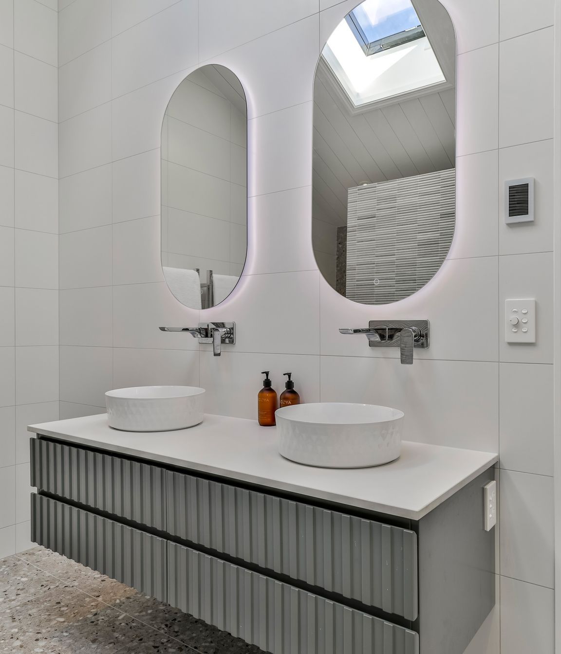 TILES & BATHWARE SUPPLIED BY TILE DEPOT . Vanity: Customised AIntree Wall Hung 1500mm / Basins: Radial 355 textured white / Mirrors: Ambience Back Lit Mirror Pill 500x1000H
