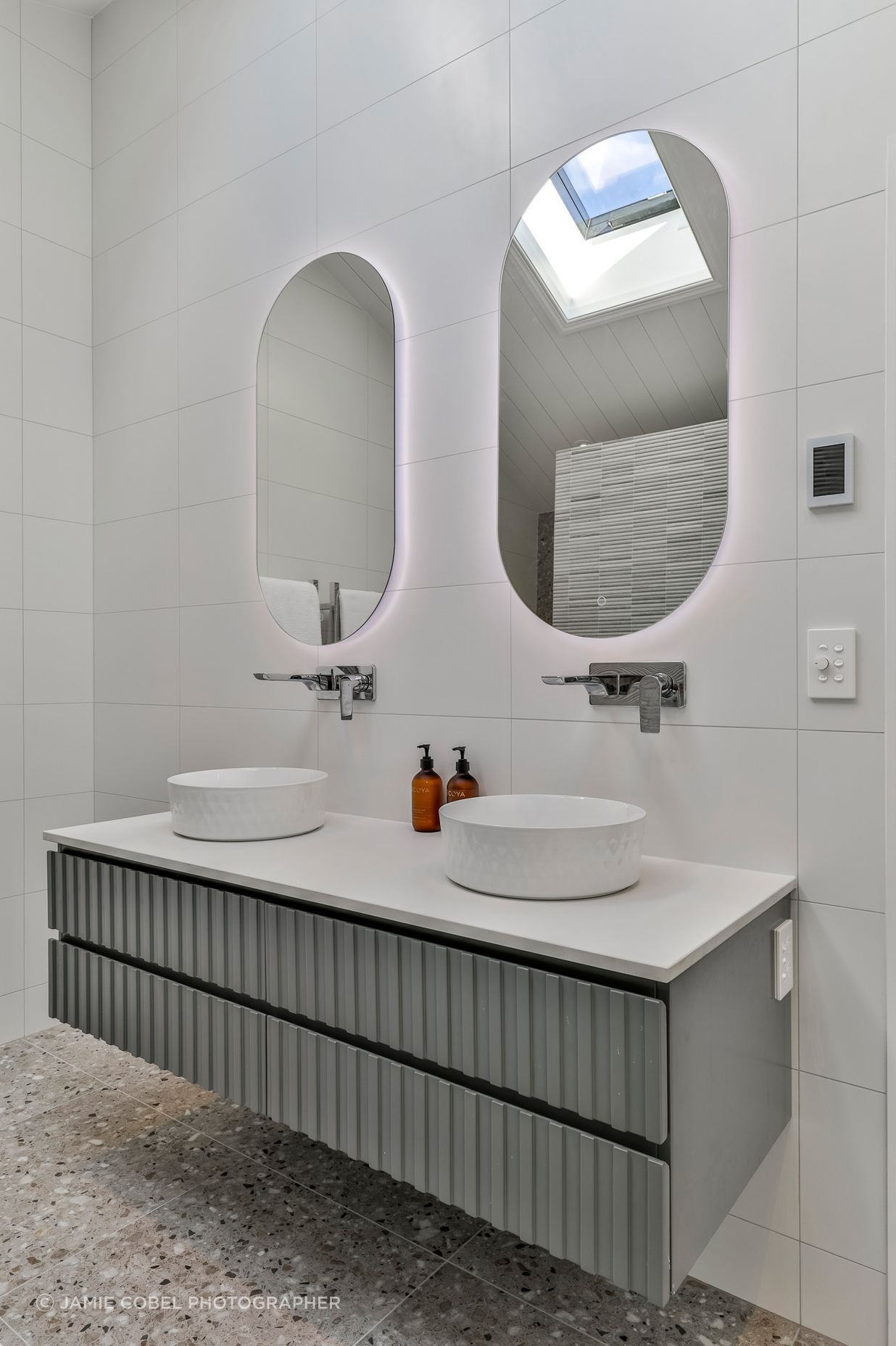 TILES & BATHWARE SUPPLIED BY TILE DEPOT . Vanity: Customised AIntree Wall Hung 1500mm / Basins: Radial 355 textured white / Mirrors: Ambience Back Lit Mirror Pill 500x1000H