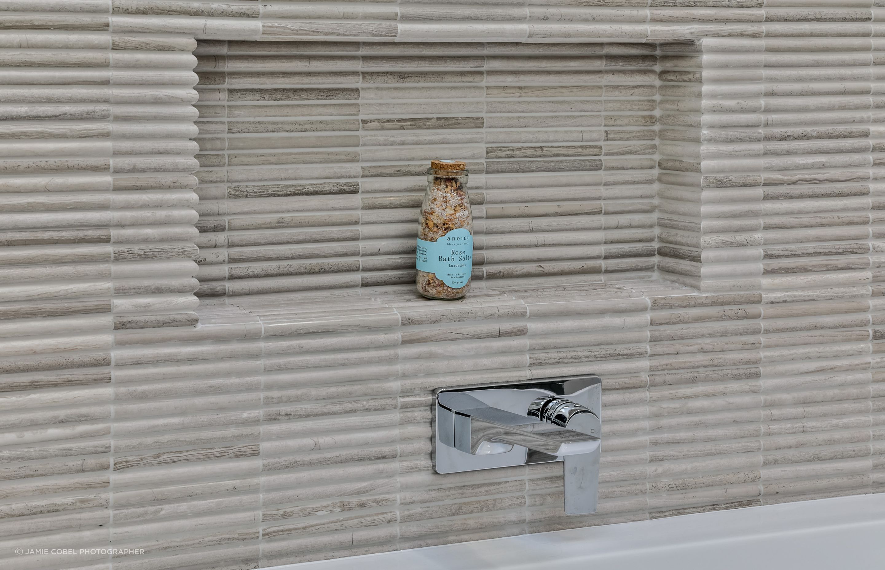 TILE DEPOT / Tiles: Colosseum Travertine 305x305mm. Fantastic mitring detail. Tiling by ARC Tiling NZ. / Tap : Olympia Wall Mounted basin Mixer Chrome