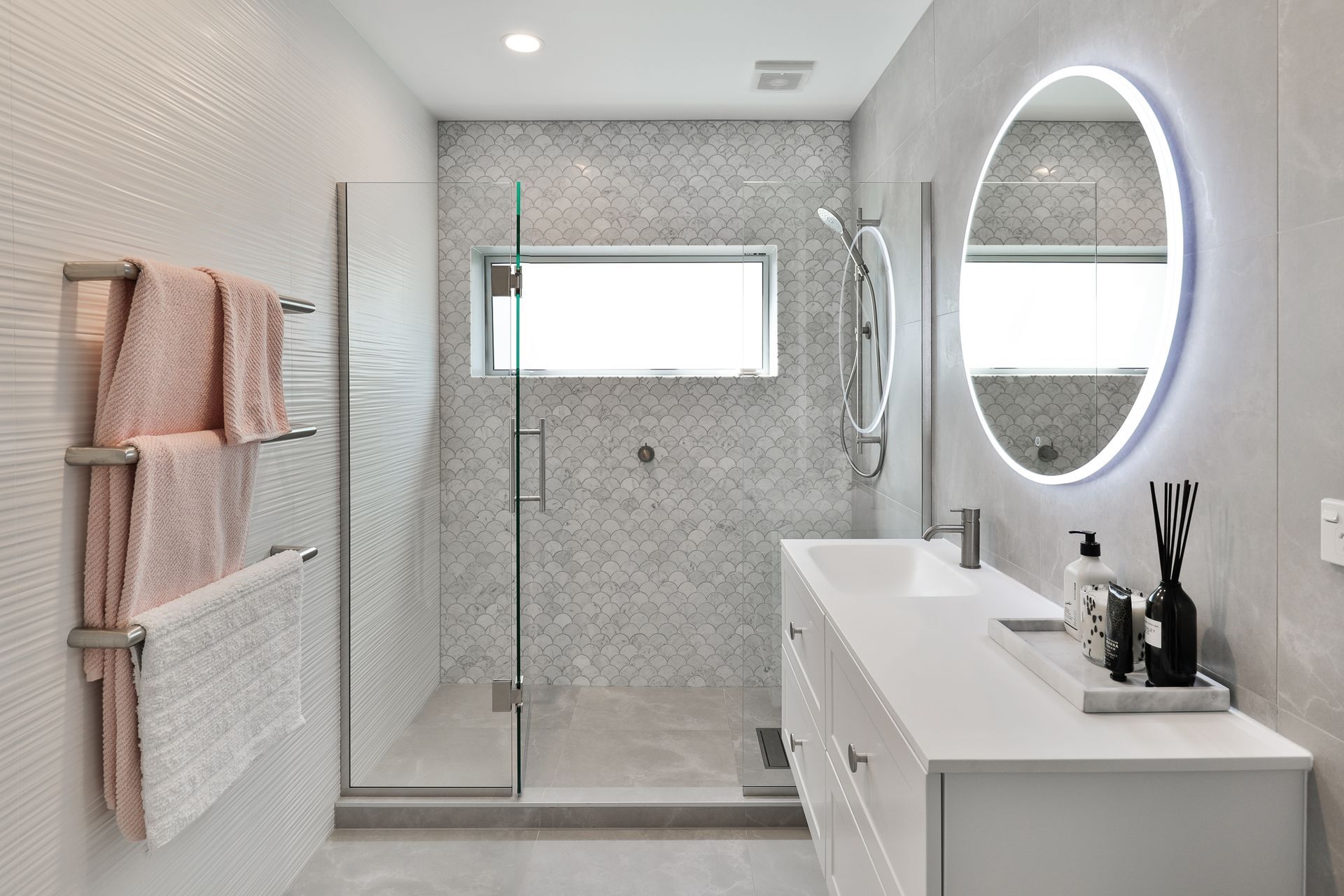 Tiles used: Stardust Moon 597x597mm floor and wall, 4D Linear white (not stocked, indent only), Fish Scale Carrara Honed Mosaic 245x265mm