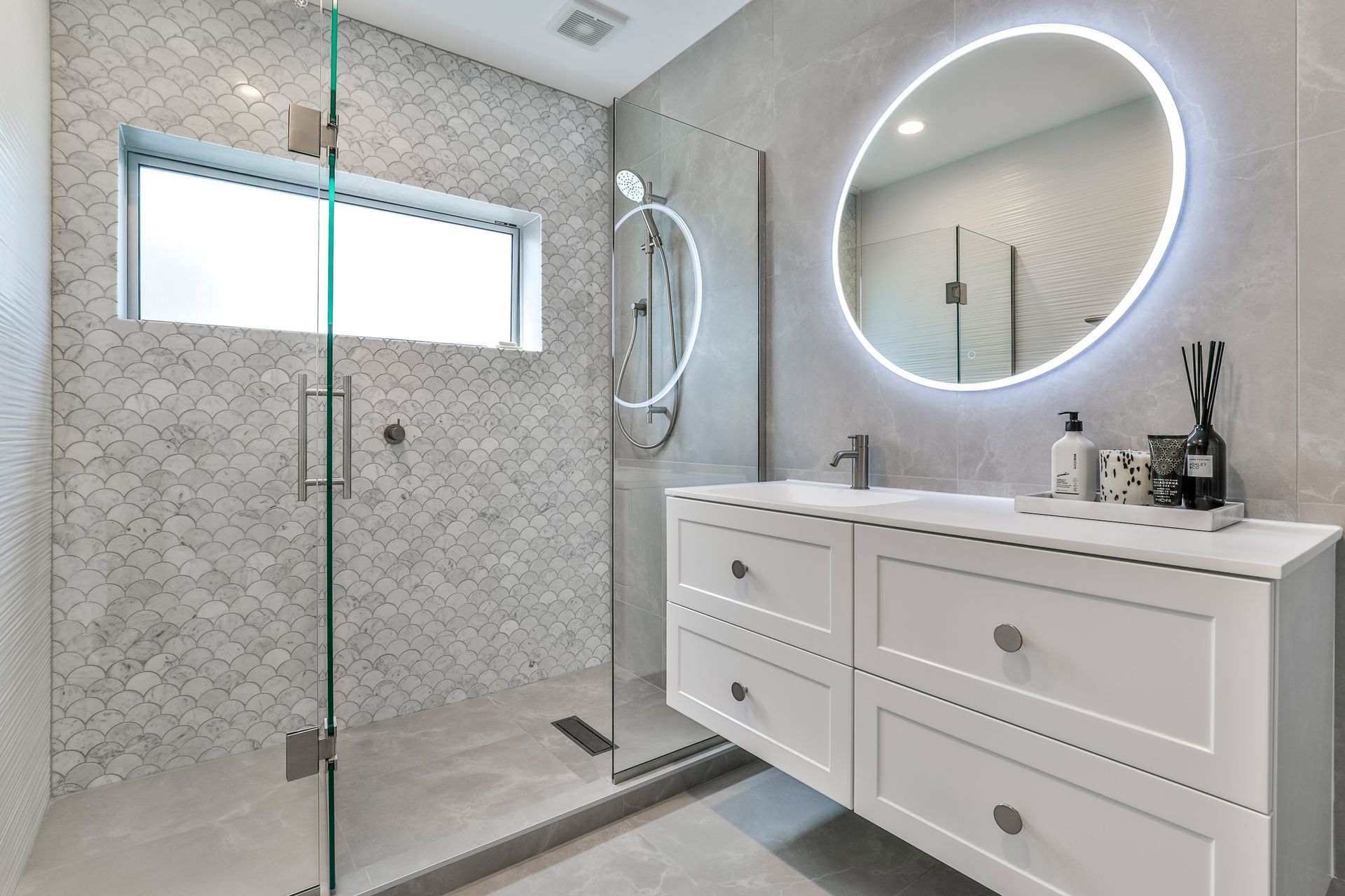 Tiles used: Stardust Moon 597x597mm floor and wall, Fish Scale Carrara Honed Mosaic 245x265mm