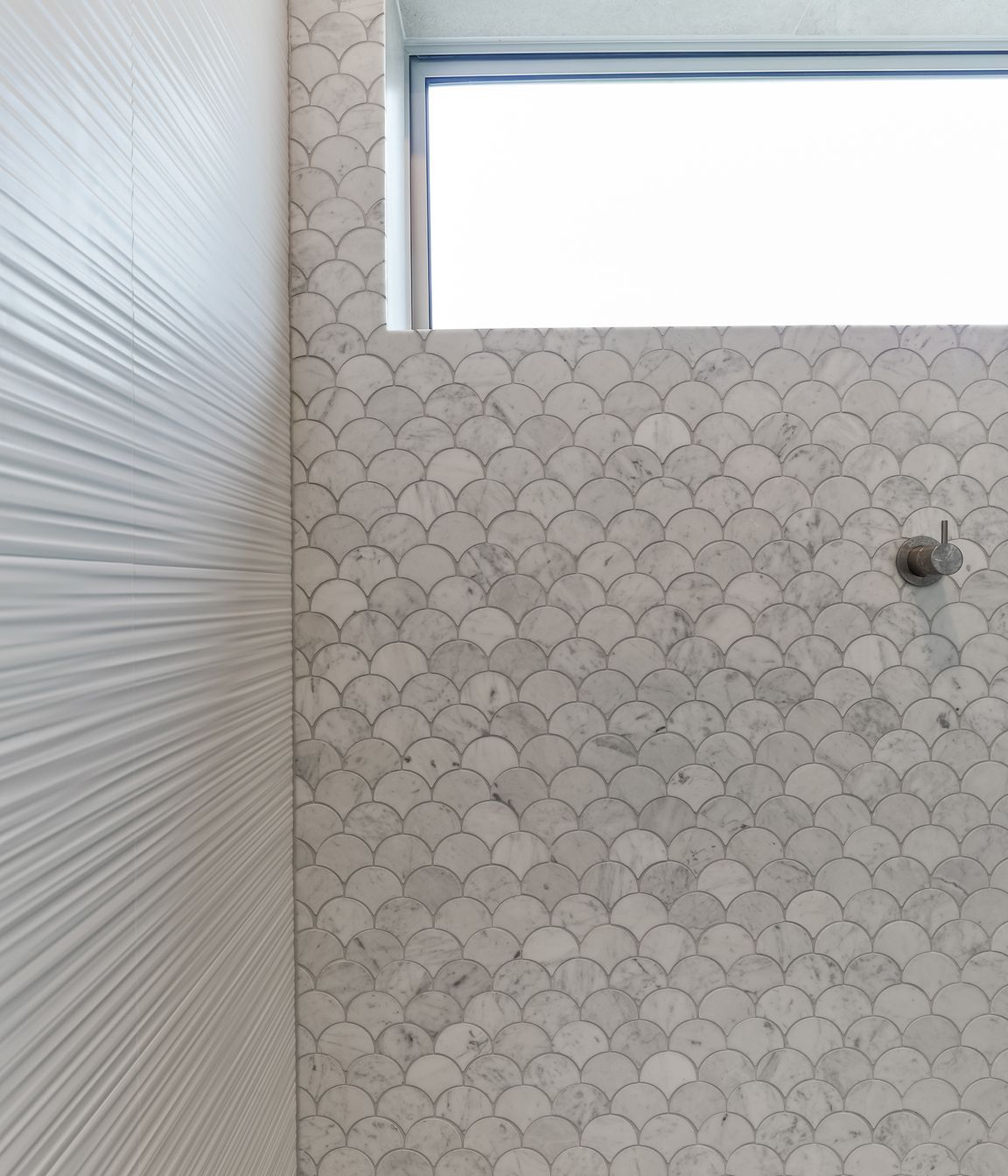 Tiles used: Stardust Moon 597x597mm floor and wall, 4D Linear white (not stocked, indent only), Fish Scale Carrara Honed Mosaic 245x265mm