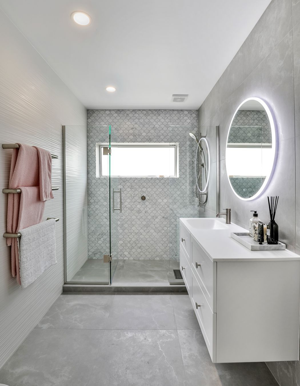 Tiles used: Stardust Moon 597x597mm floor and wall, 4D Linear white (not stocked, indent only), Fish Scale Carrara Honed Mosaic 245x265mm