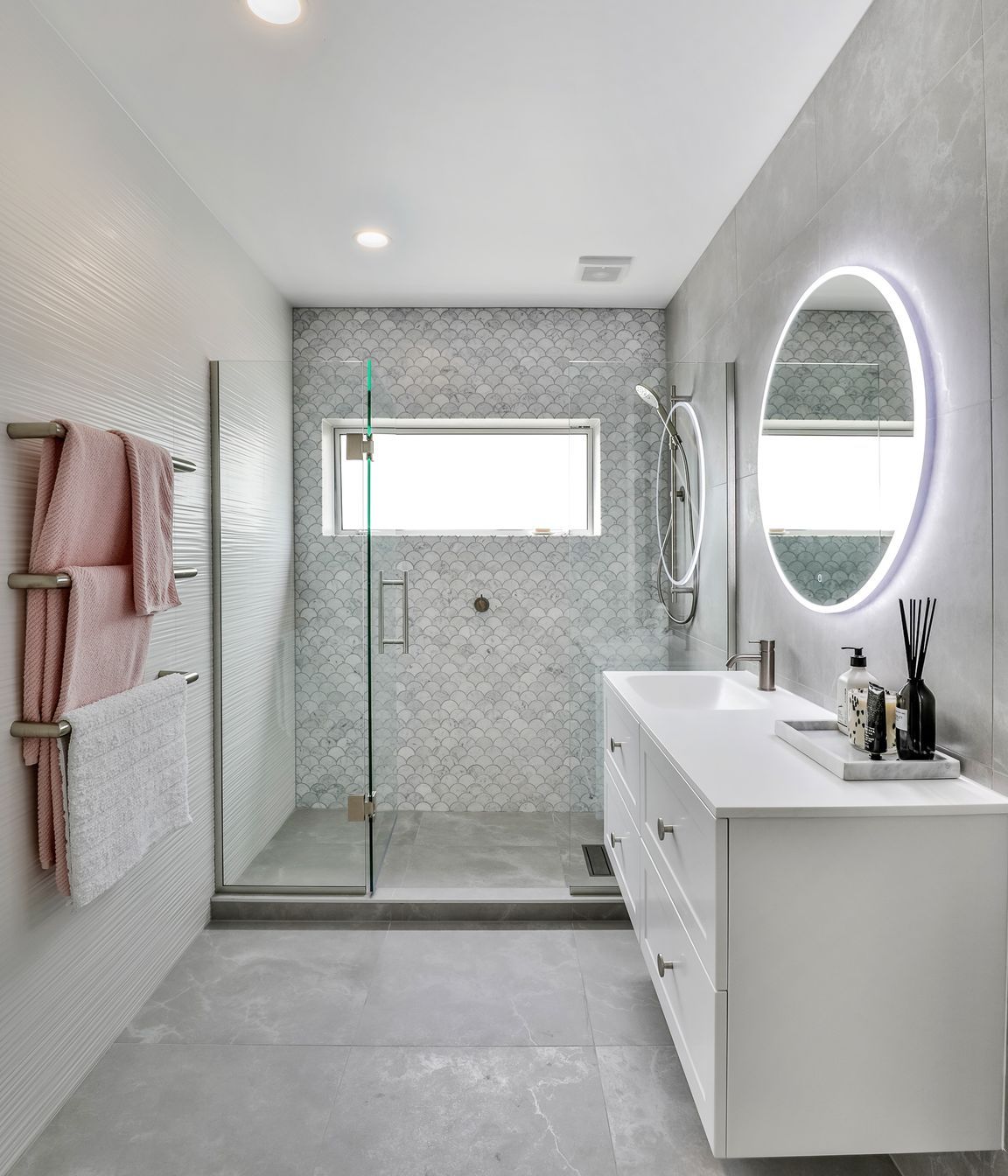 Tiles used: Stardust Moon 597x597mm floor and wall, 4D Linear white (not stocked, indent only), Fish Scale Carrara Honed Mosaic 245x265mm