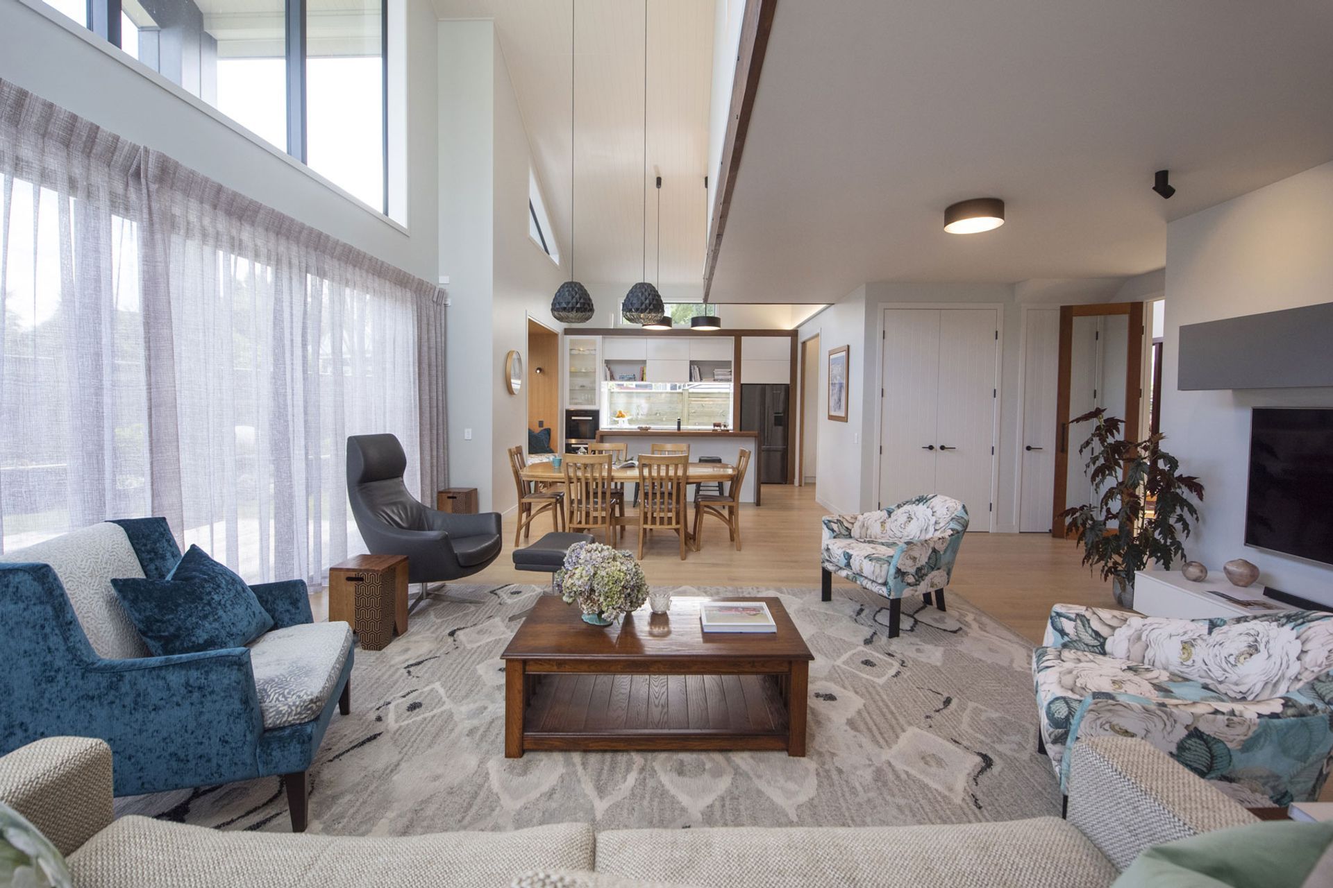 Open plan living with a wool floor rug to zone the space