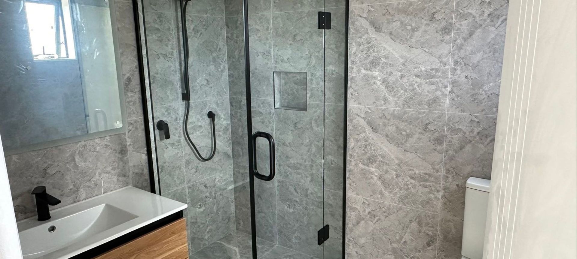 Damn Good Tiling - full tiled bathroom banner