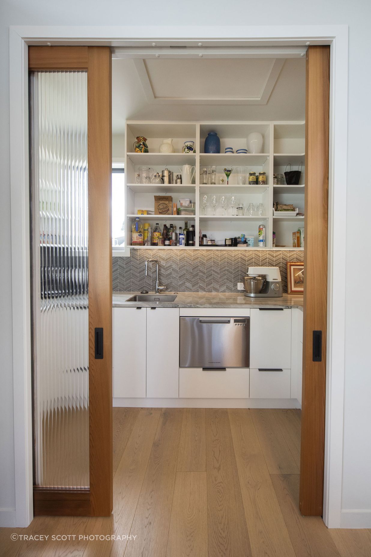 Reeded glass doors into walk in pantry