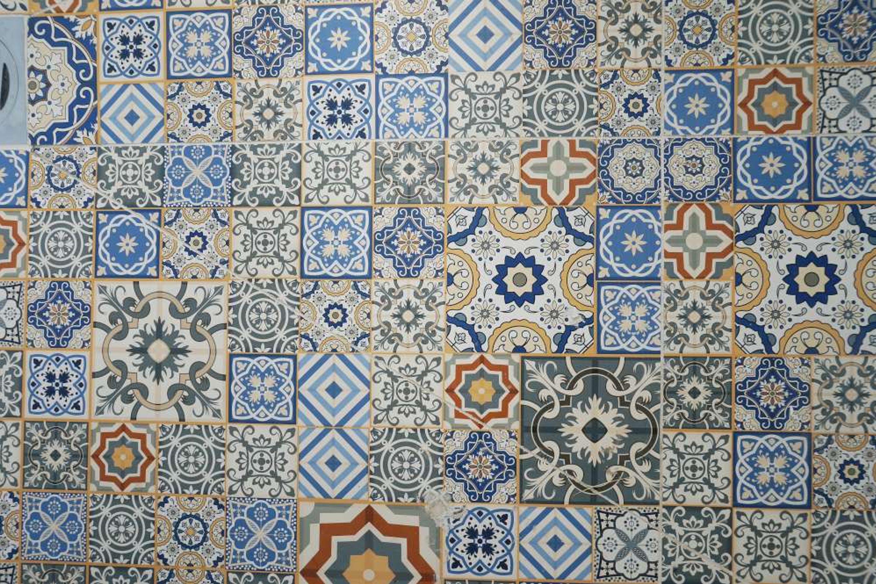 Designer mosaic tiles used on bathroom floor