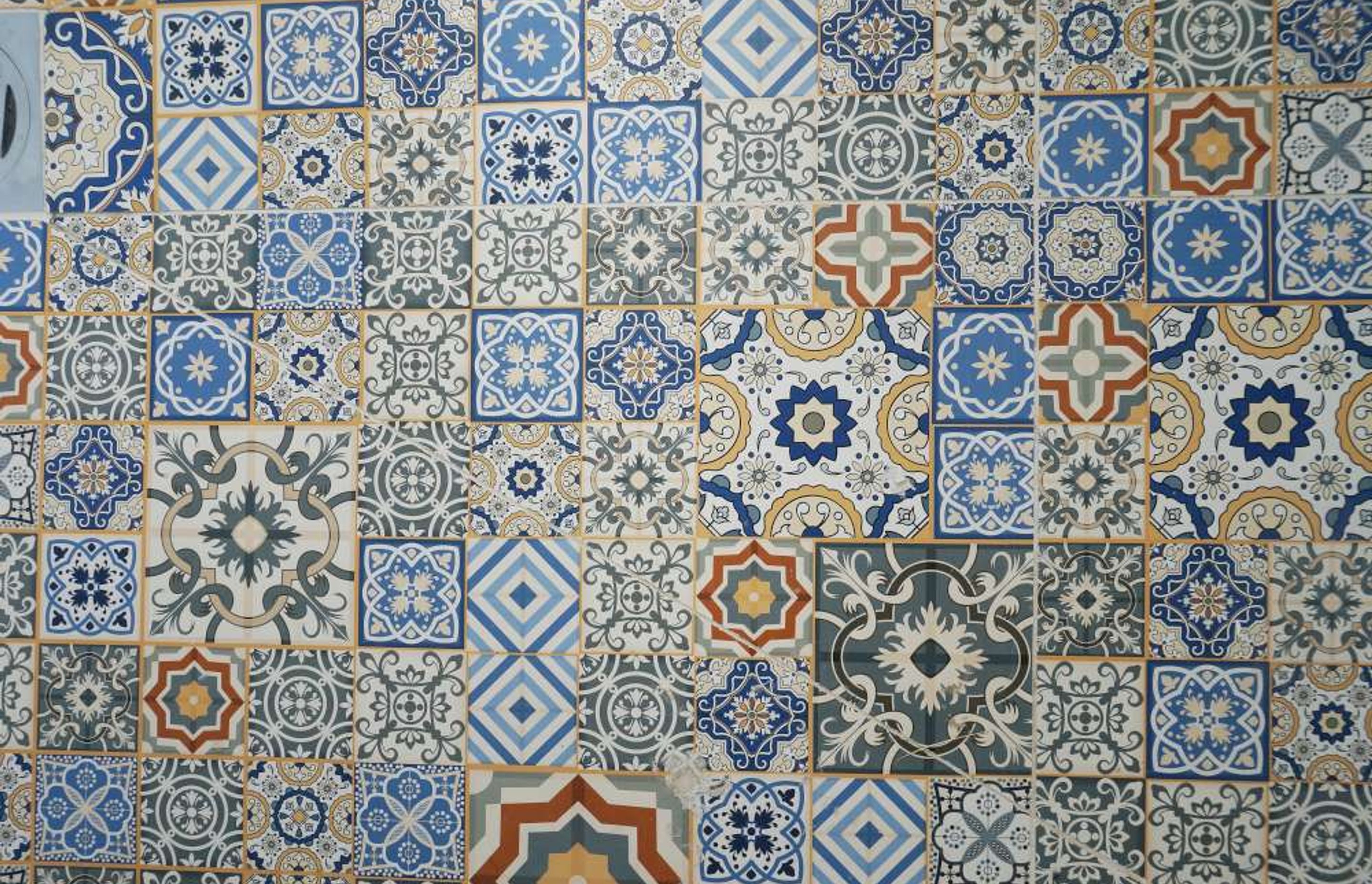 Designer mosaic tiles used on bathroom floor