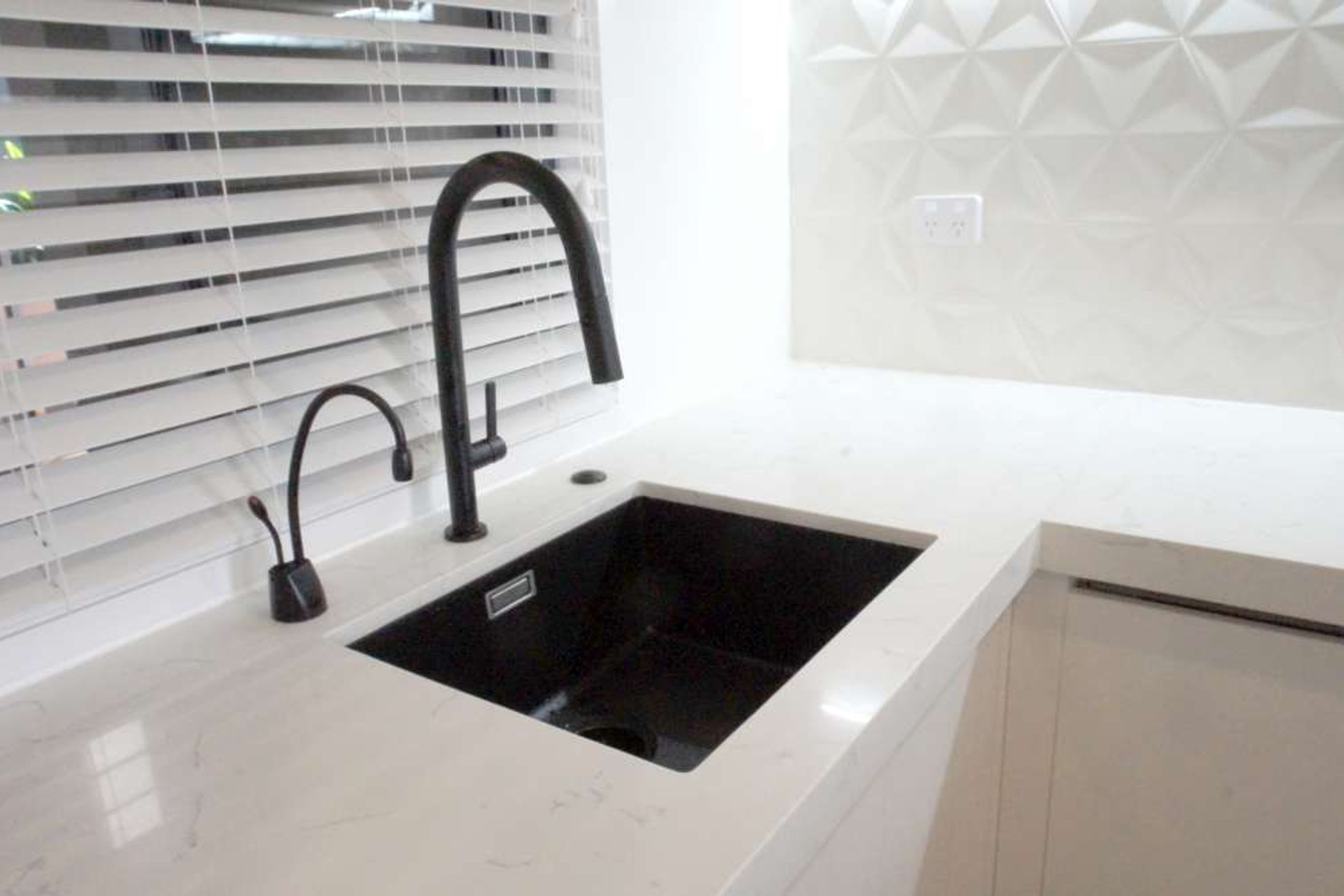 Sink installed with a hot water tap adding to convenience while being environmentally sustainable 
