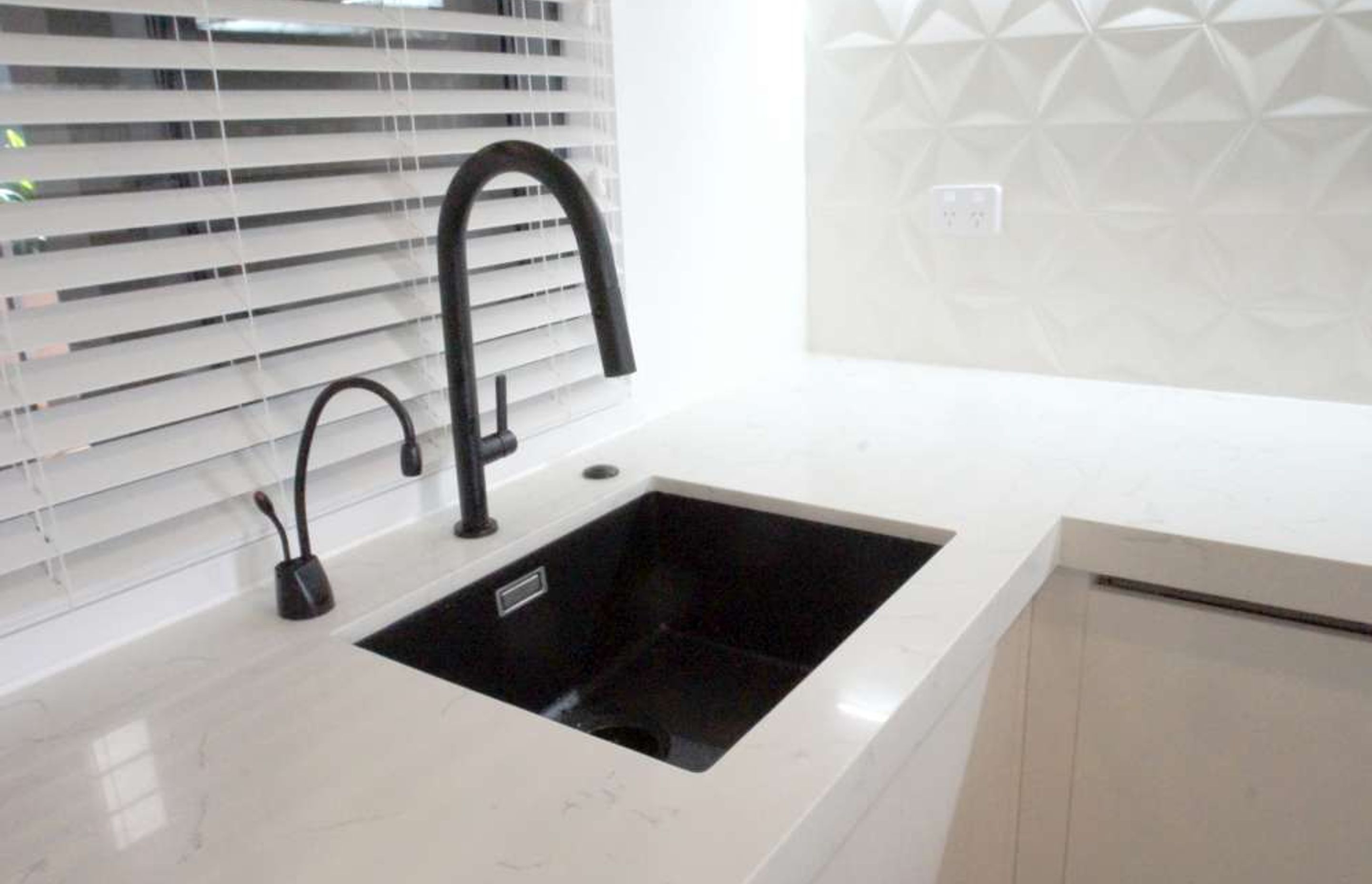 Sink installed with a hot water tap adding to convenience while being environmentally sustainable 