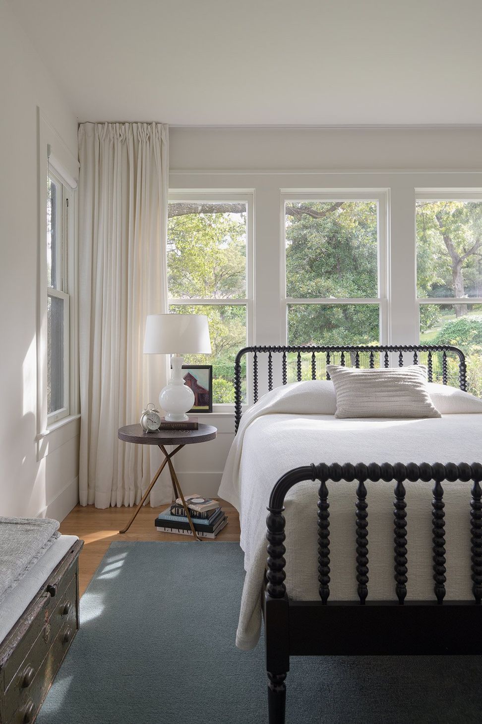 11HeritageOakCottageCuppettKilpatrickArchitectureandInteriorDesignaustin-tx-traditional-bedroom-spindle-bed-natural-view.jpg