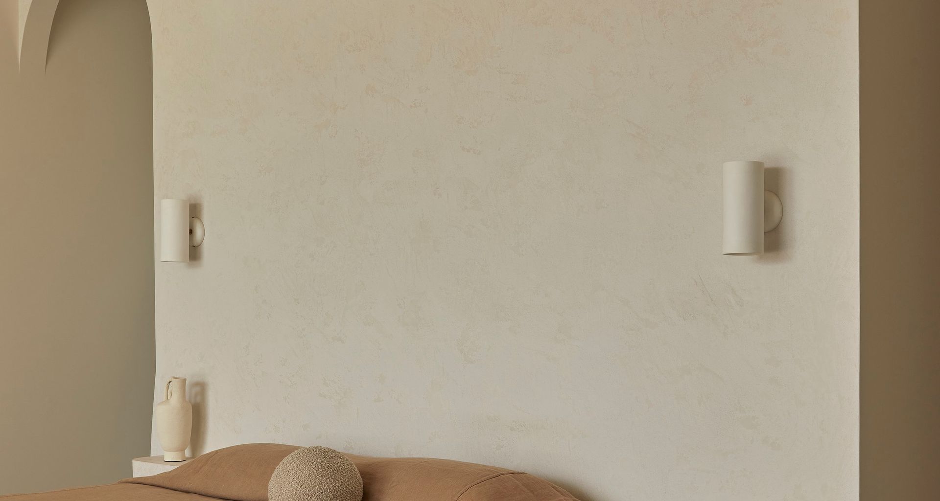 Studio Enti’s Eos Wall Lights beautifully blending with the natural palette of the home.