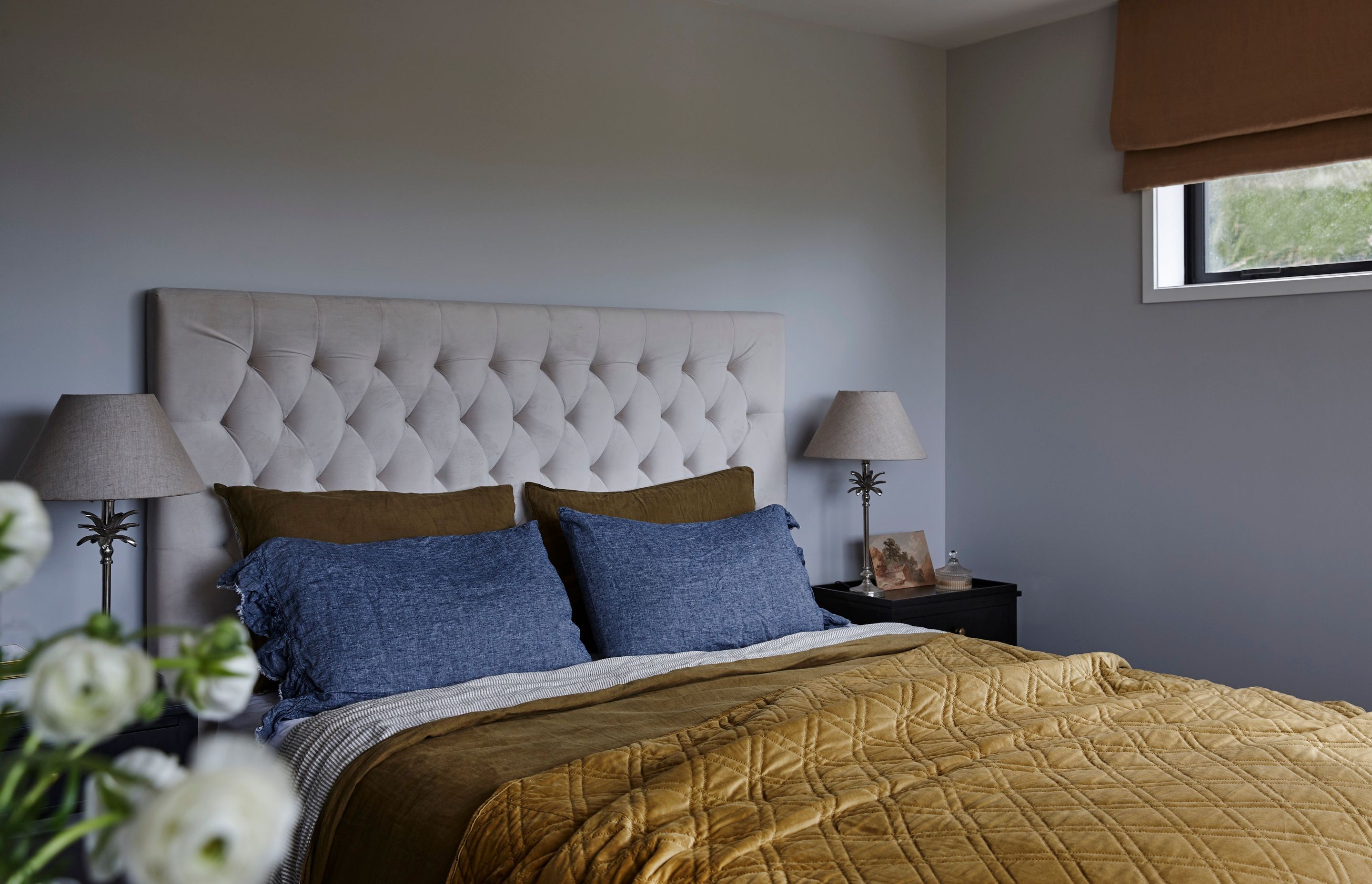 Two symmetrical photos Master bedroom interior design & decor featuring blues & golds