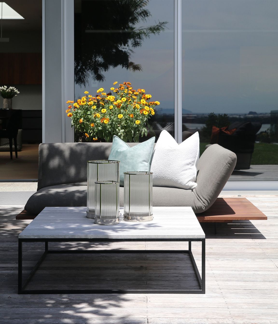 Custom outdoor coffee table with a metal frame &amp; Ocean Travertine top