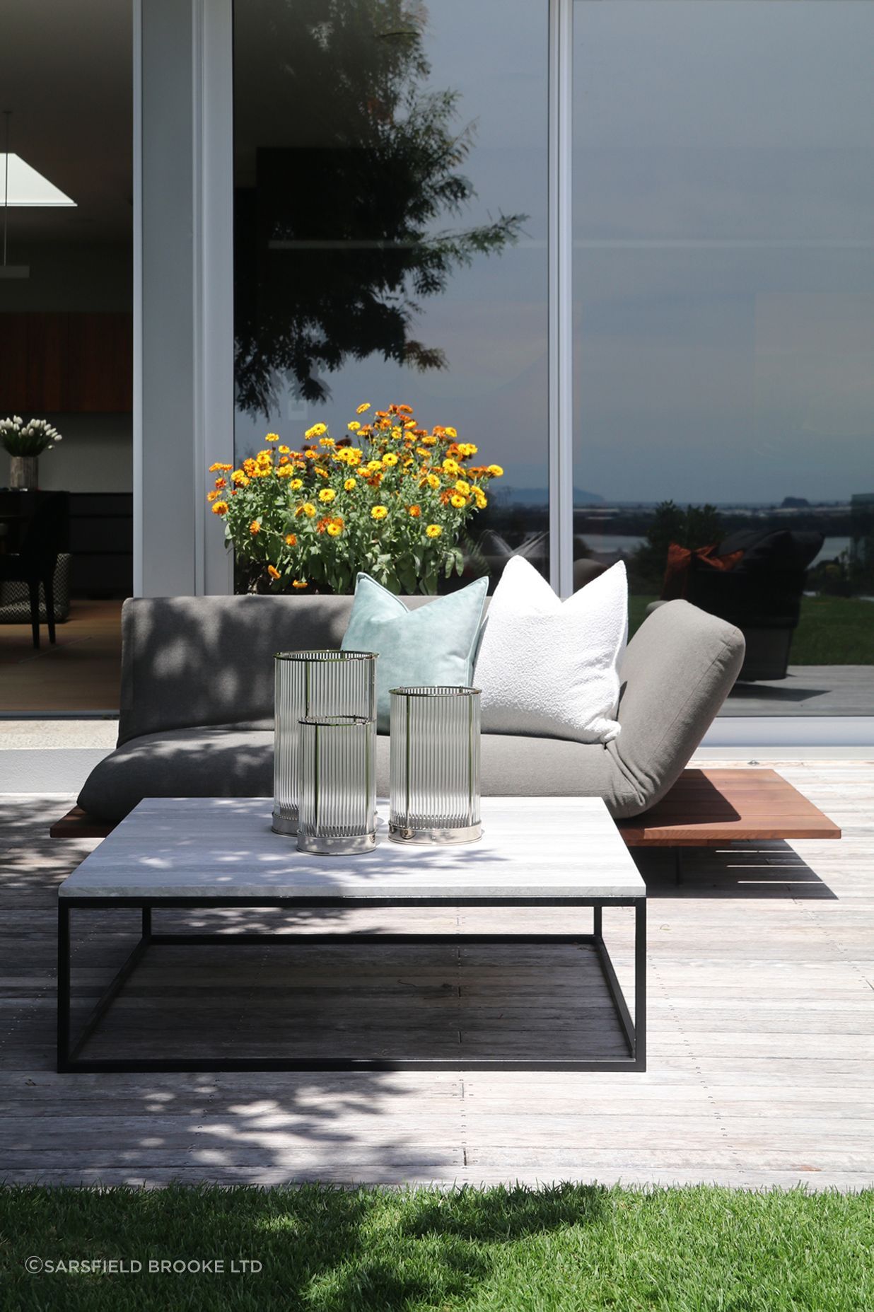 Custom outdoor coffee table with a metal frame &amp; Ocean Travertine top