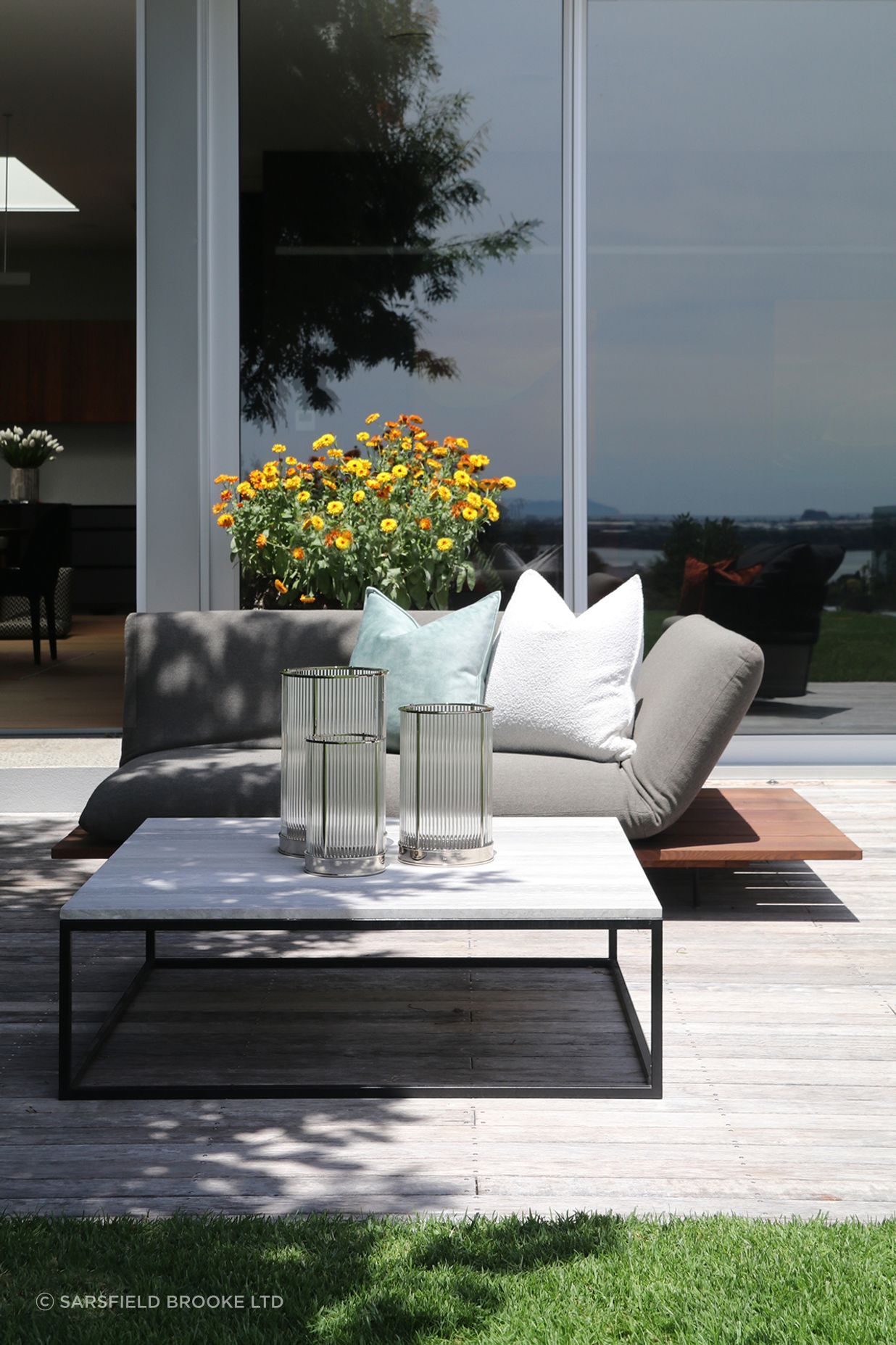 Custom outdoor coffee table with a metal frame & Ocean Travertine top