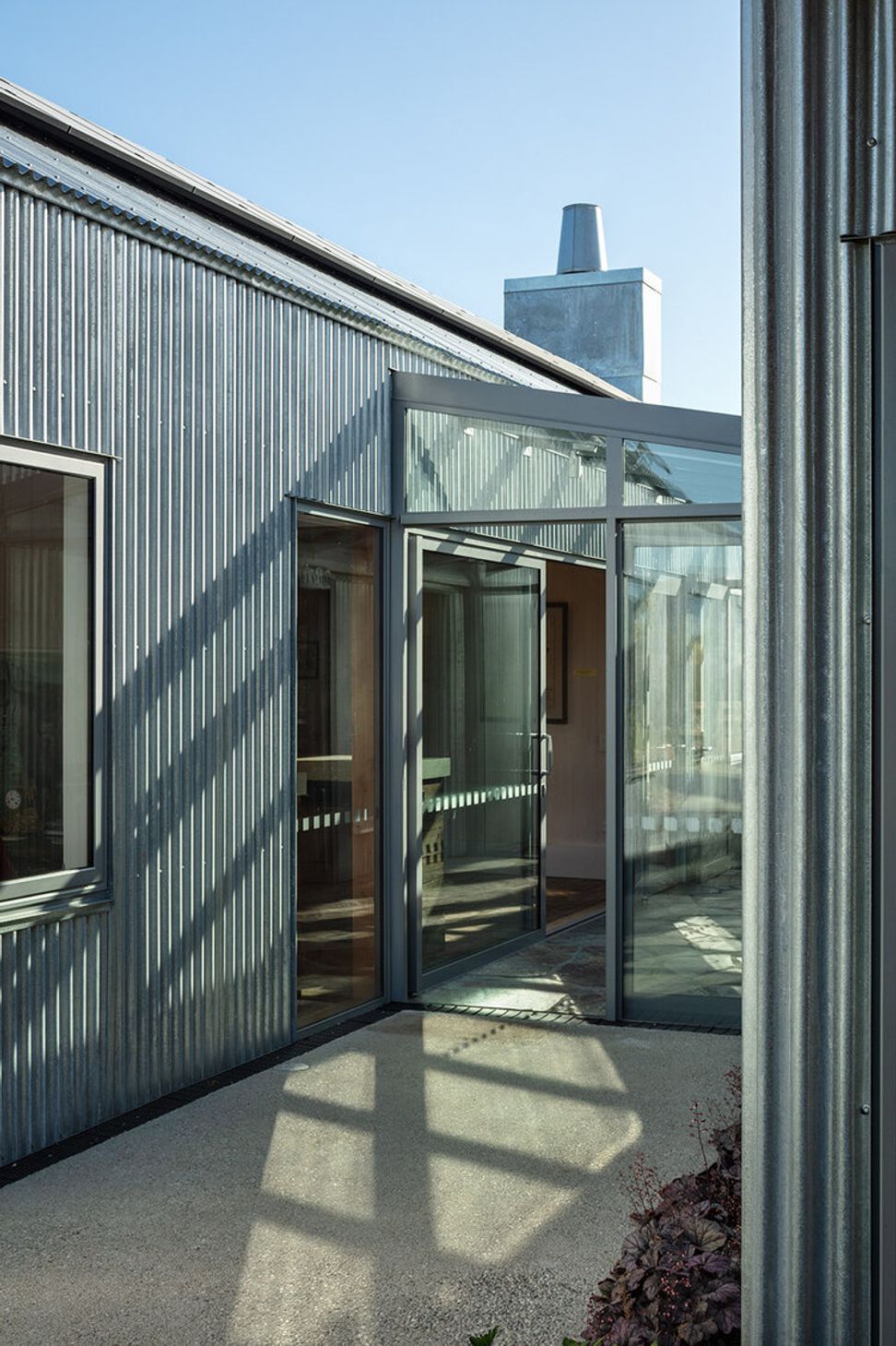 The glazed entry foyer is the connection between the two buildings.