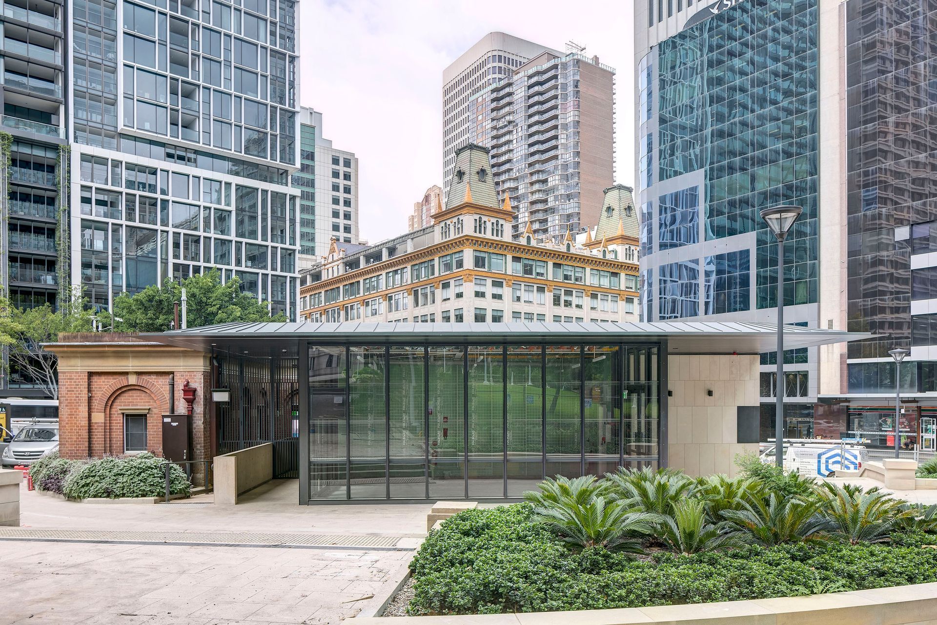   The horizontal roof serves to declutter the outlook, resulting in the Downing Centre beyond gaining an increased presence within the park.