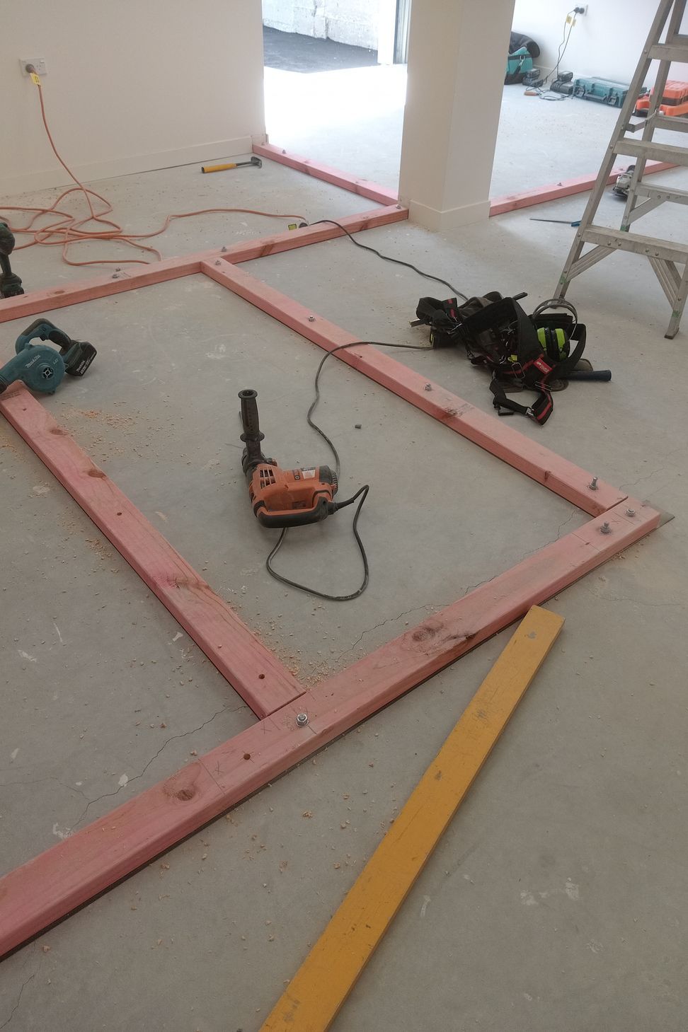 3-42-Thames-St-Oamaru-Caroline-Eve-laying-out-the-bottom-plate-for-framing-for-the-changing-rooms-JDBuilders.jpg