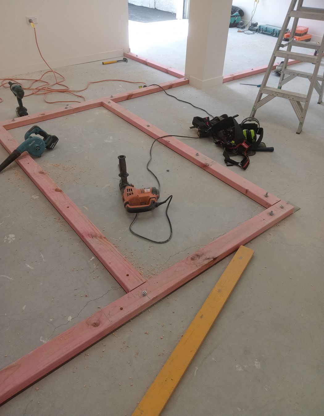 3-42-Thames-St-Oamaru-Caroline-Eve-laying-out-the-bottom-plate-for-framing-for-the-changing-rooms-JDBuilders.jpg