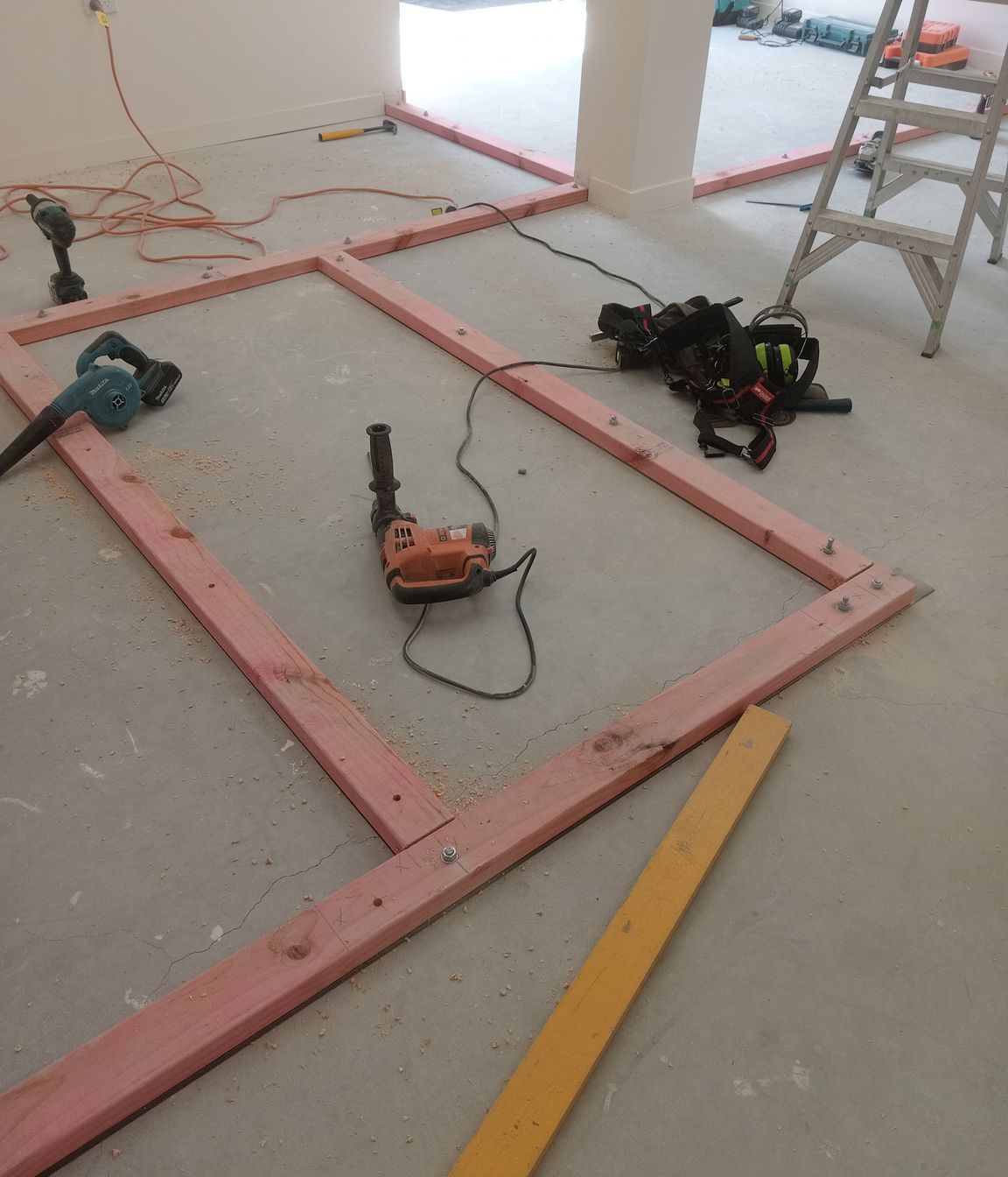 3-42-Thames-St-Oamaru-Caroline-Eve-laying-out-the-bottom-plate-for-framing-for-the-changing-rooms-JDBuilders.jpg
