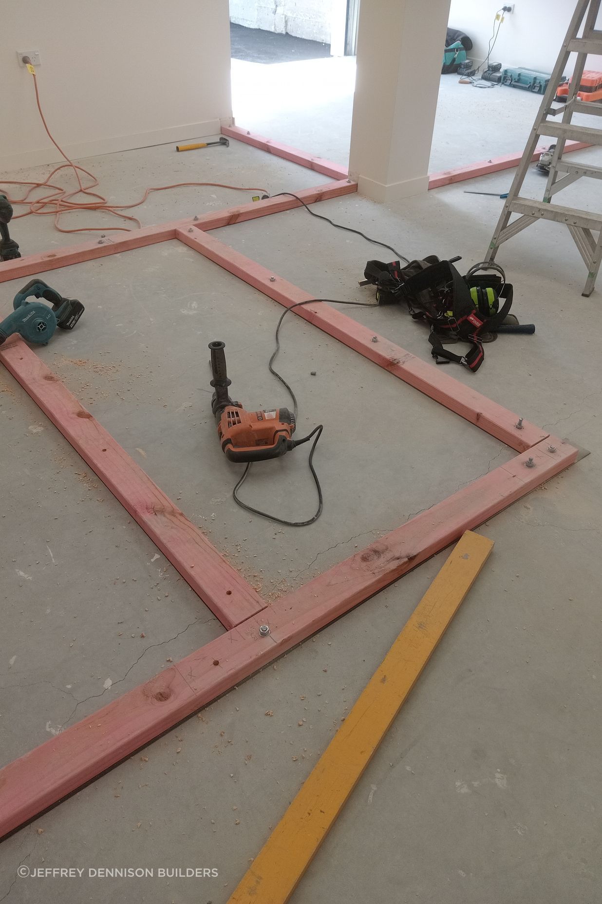 3-42-Thames-St-Oamaru-Caroline-Eve-laying-out-the-bottom-plate-for-framing-for-the-changing-rooms-JDBuilders.jpg