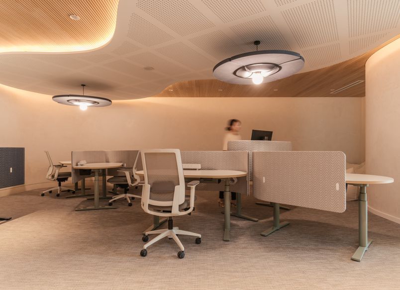 A boutique workplace fit-out celebrates texture, craftsmanship, and trust.