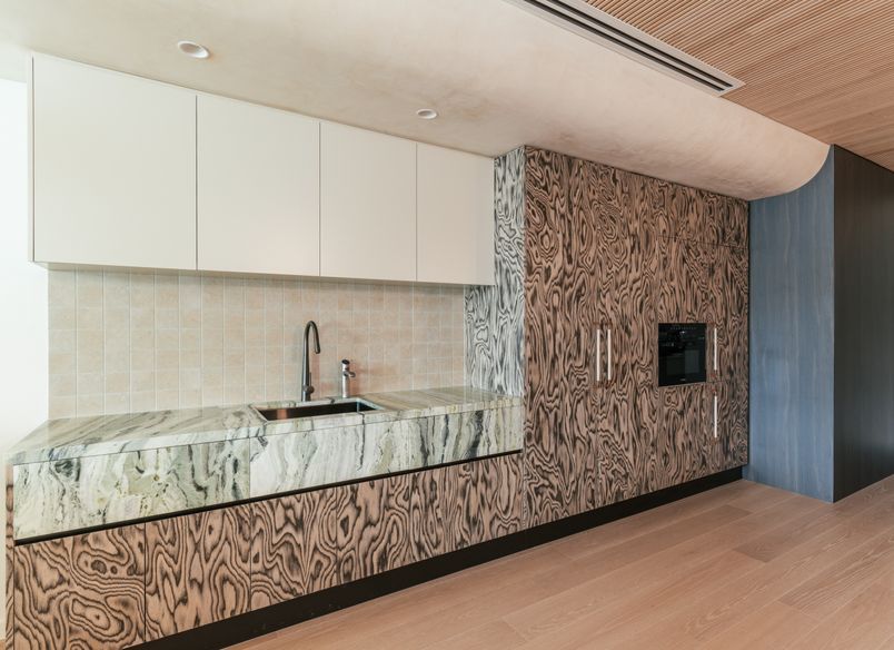 A boutique workplace fit-out celebrates texture, craftsmanship, and trust.