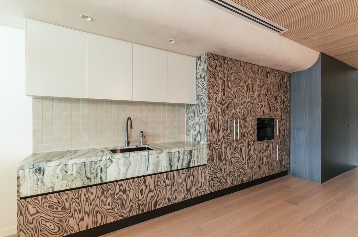 A boutique workplace fit-out celebrates texture, craftsmanship, and trust.