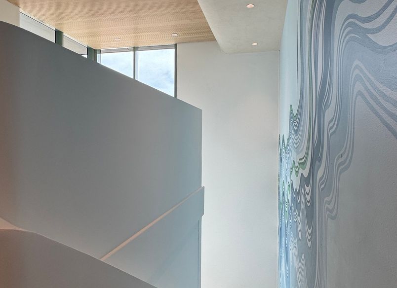 A boutique workplace fit-out celebrates texture, craftsmanship, and trust.