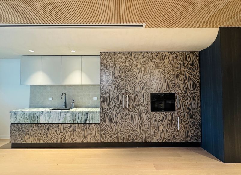 A boutique workplace fit-out celebrates texture, craftsmanship, and trust.