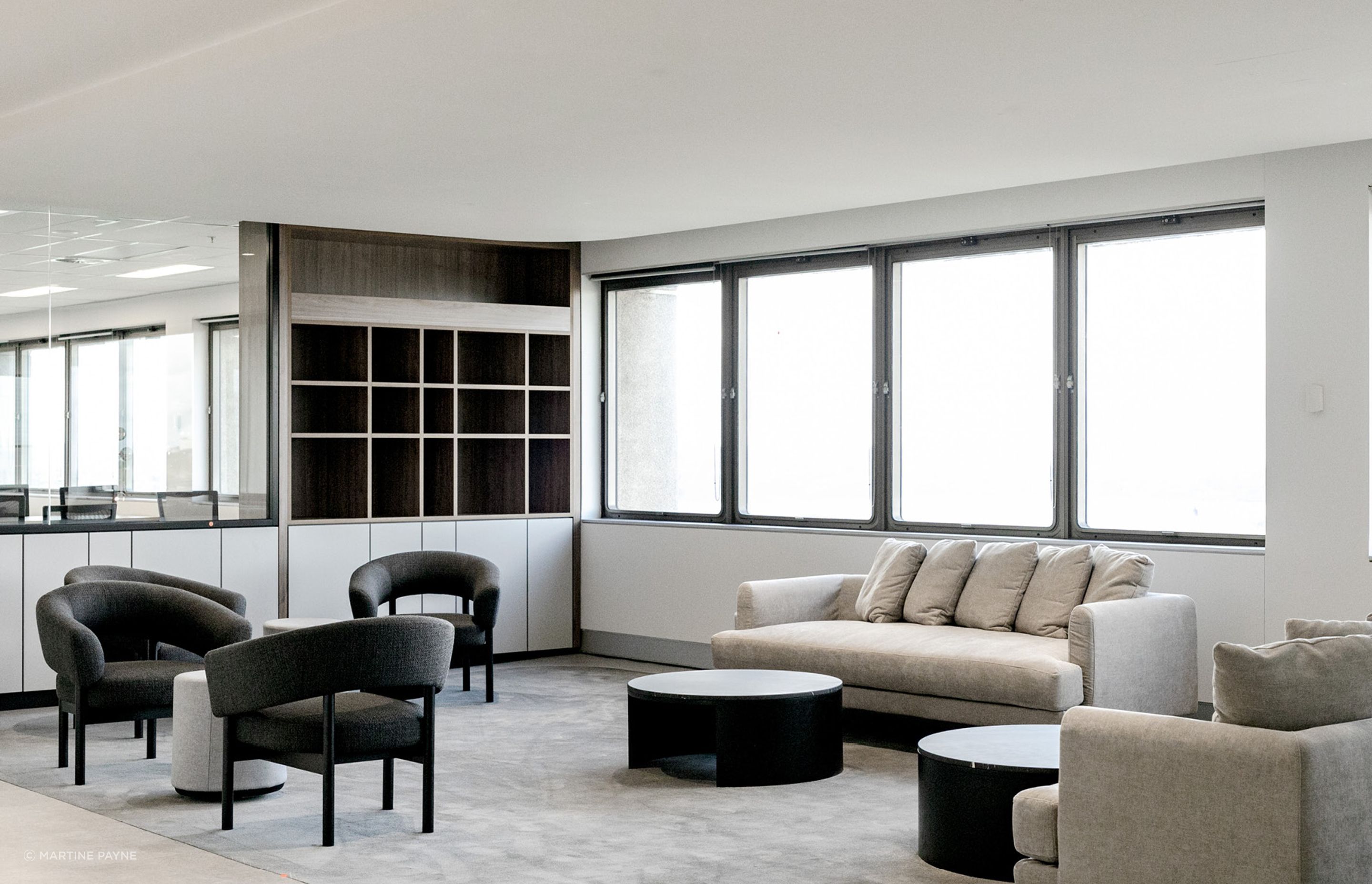 Pictured here: Jenson Occasional Chair and Oberon Crescent Marble Coffee Table