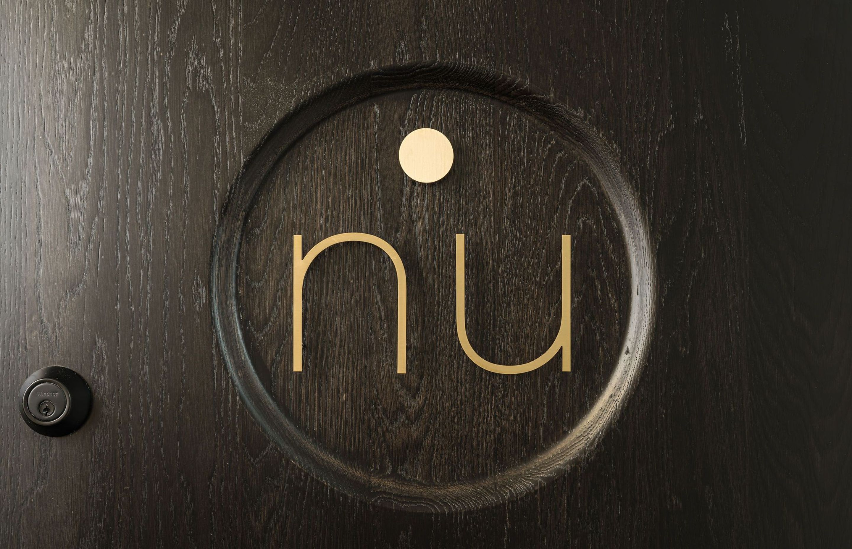 nu Yoga Studio Dunedin. nu Logo on the front door