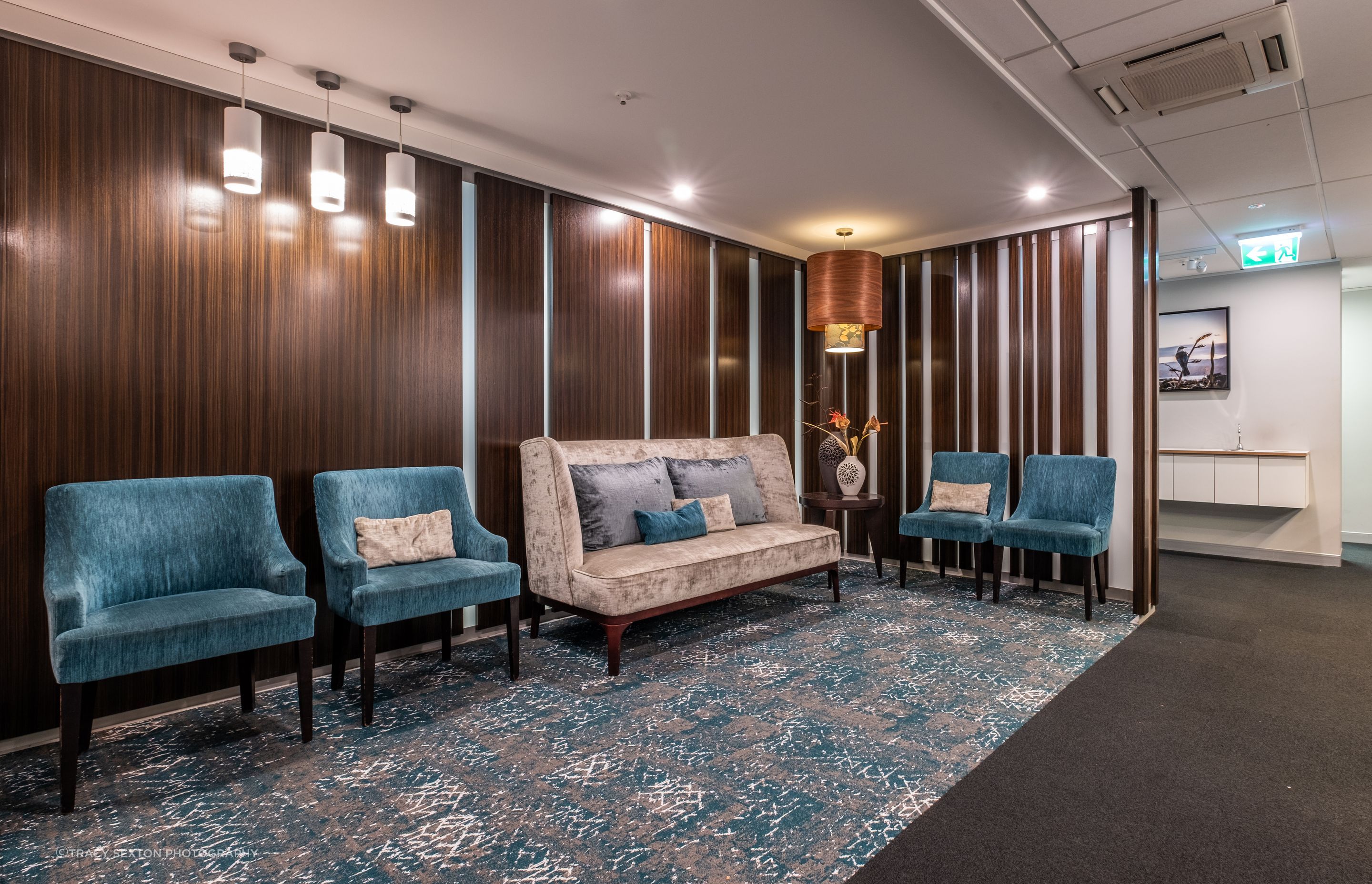 A dental practice with a difference as it has a lounge for a waiting area - Home away from Home using quality NZ made furniture by David Shaw.