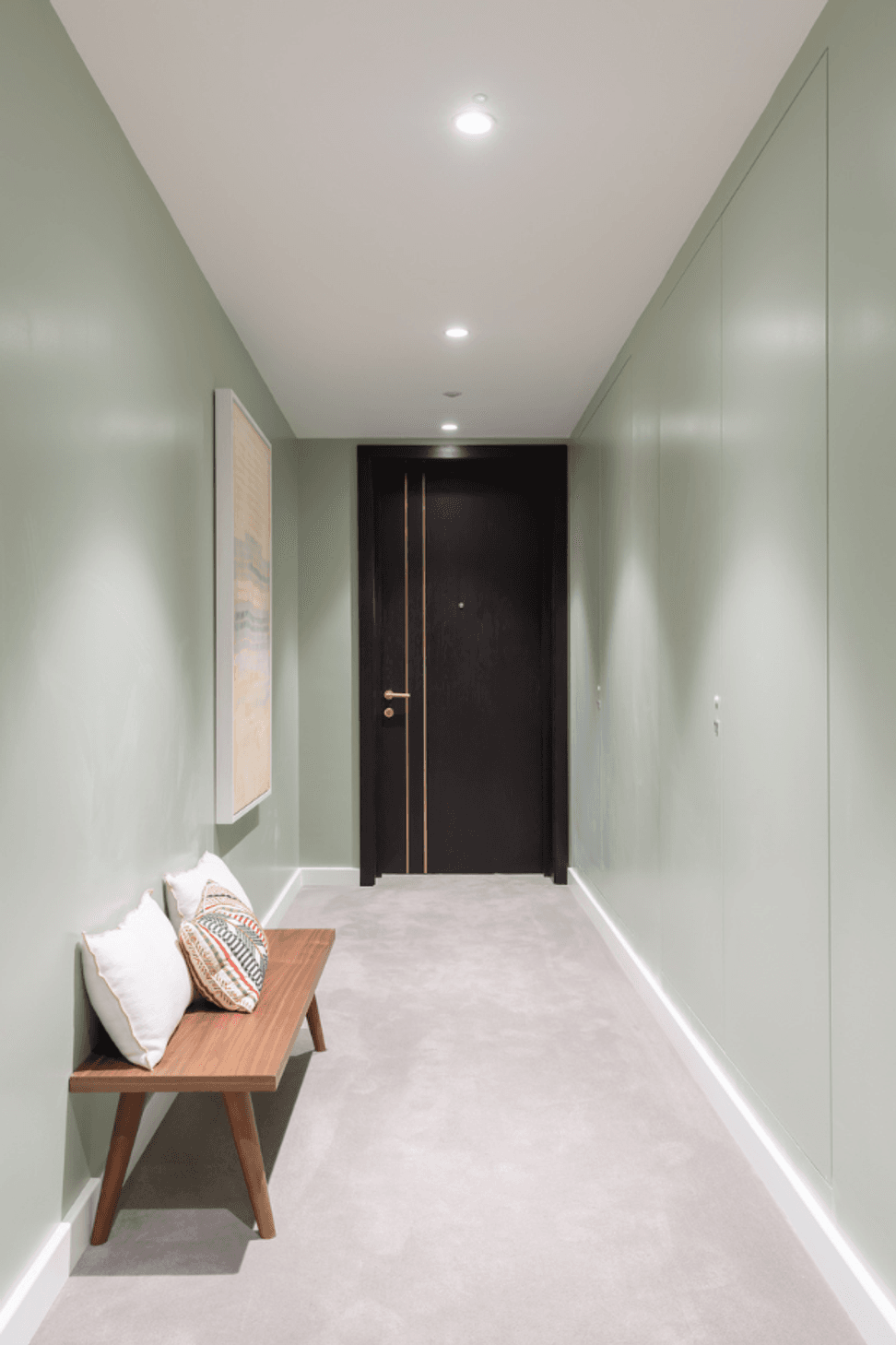 The right-side wall hides servicing panels all along with AccessDor openings painted to match the pale green palette.