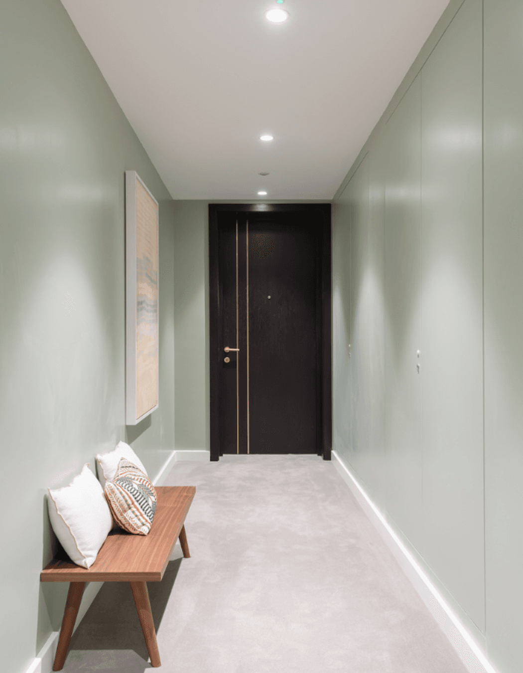 The right-side wall hides servicing panels all along with AccessDor openings painted to match the pale green palette.