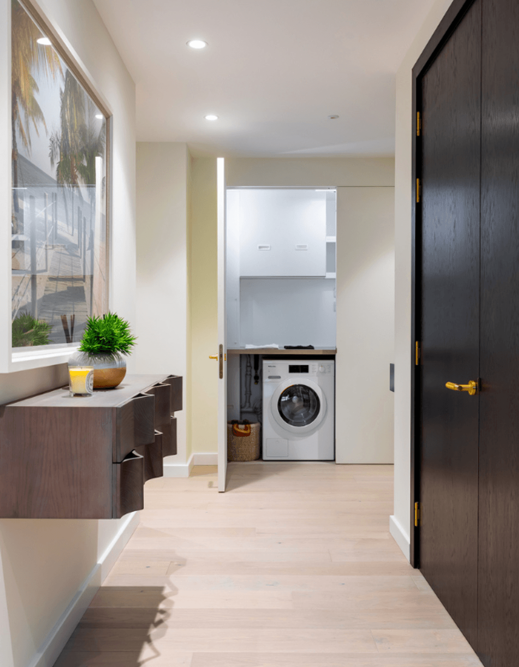 The same door open - revealing the laundry and services space hidden behind.