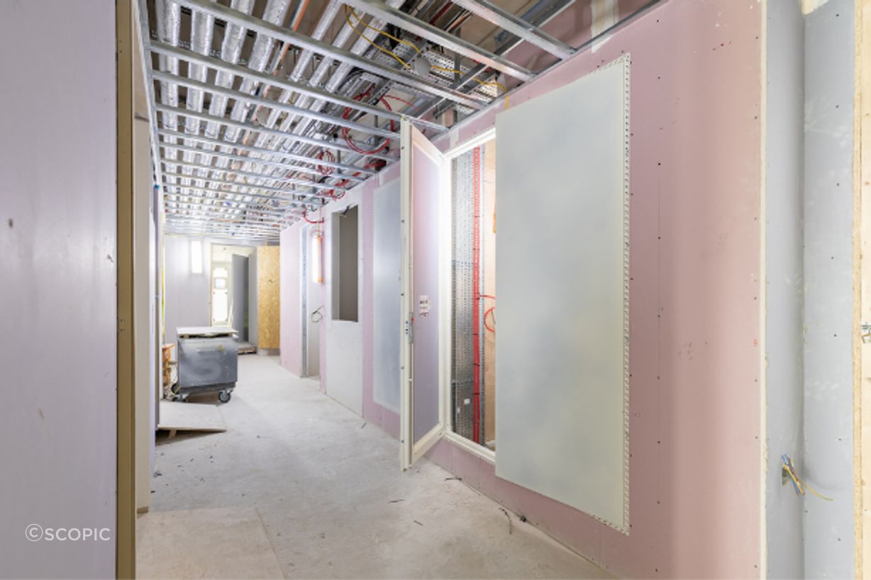 A Standard AccessDor riser door panel installed during construction.